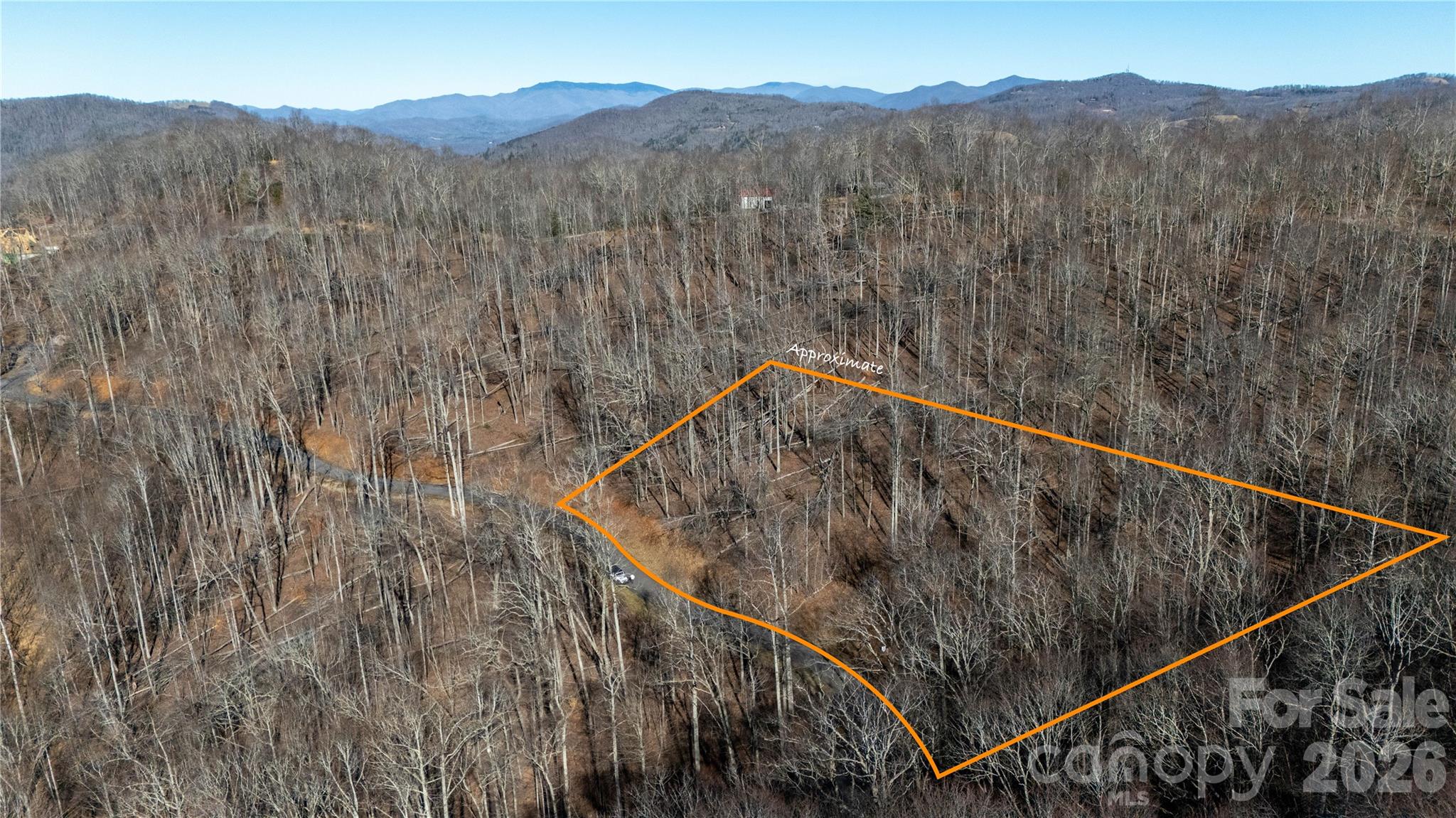 Build your mountain home in the private, gated community of Mountain Brook Estates, a 600-acre subdivision tucked into the hills of Mitchell County, just off the Blue Ridge Parkway. This spacious lot offers a quiet, natural setting with gentle topography and wooded surroundings. Mountain Brook Estates features three stocked trout ponds, a community pavilion, an easy walking trail to one of the famous waterfalls, Crabtree Falls, and direct access to Pisgah National Forest for hiking and outdoor adventure. The community is equipped with paved roads, gravel roads underground utilities, cable, and high-speed internet, making this a great site for year-round living, a vacation home, or future investment. Just 10 miles from Spruce Pine’s shops and restaurants, this land combines mountain privacy with convenient access to local amenities. Whether you’re ready to build now or hold for the future, this lot presents a wonderful opportunity in a well-established Western NC mountain community. This is a vacant lot, the cabins in the photos have be added virtually to show case just a few of many possibilities in this beautiful area.
