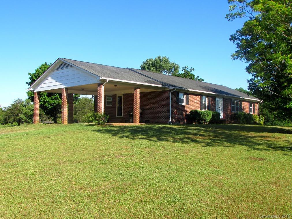 Country living at its best! Well maintained all brick ranch positioned on over 15 acres of fenced land just waiting for the horses. Home offering 3 BR/2 BA, 2 car carport, dining room, formal living room, and partially finished basement. WON'T LAST!