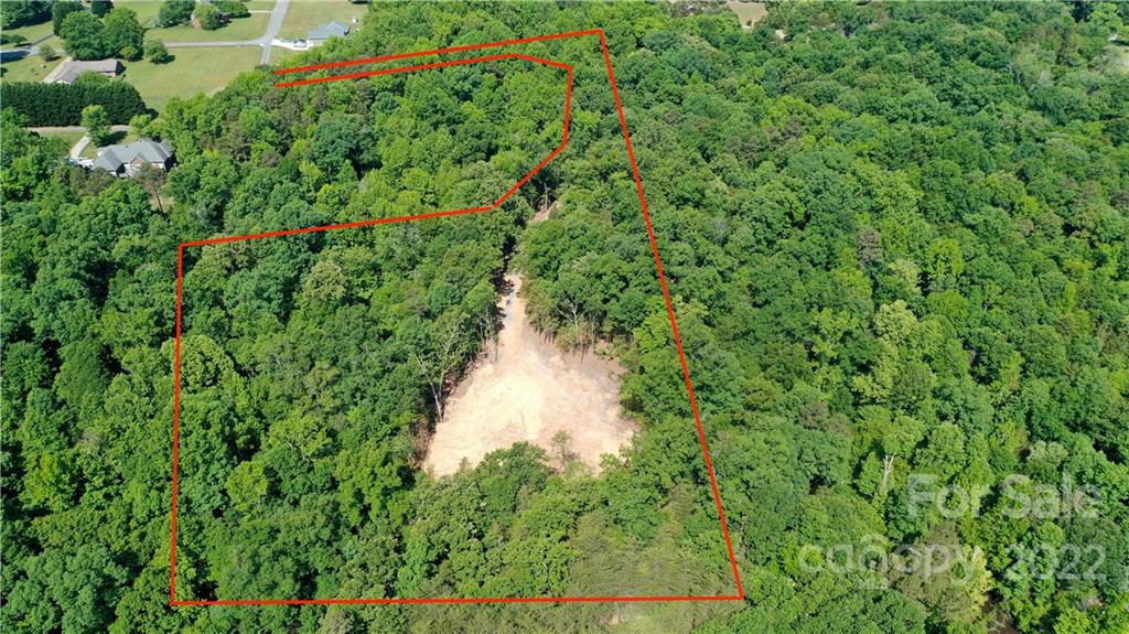 CALL FOR BEST AND HIGHEST by Sat (6/18) at 8pm.   RARE FIND: The privacy of tranquil woods in coveted Belmont without an HOA!  This beautiful, private lot boasts a total of just over four and a half acres, mature Cypress, Oak and Poplar trees, toward the end of Minnie Queen Lane.  The lot slopes down at the front of the property, which serves as a natural separation between lots. 
Ready to Build:  The construction driveway has been installed, a great homesite location has been cleared and the well and septic permit has been approved.  The land has perc'ed for 5 bedrooms.  There are no city taxes or HOA fees. This lot is close to the new Morning side marina/restaurant that offers boat slips and dry boat storage options and the Daniel Stowe botanical gardens.  It is also 10 min from downtown Belmont and less than 30min from the airport.  Belmont schools. Address has not yet been assigned.