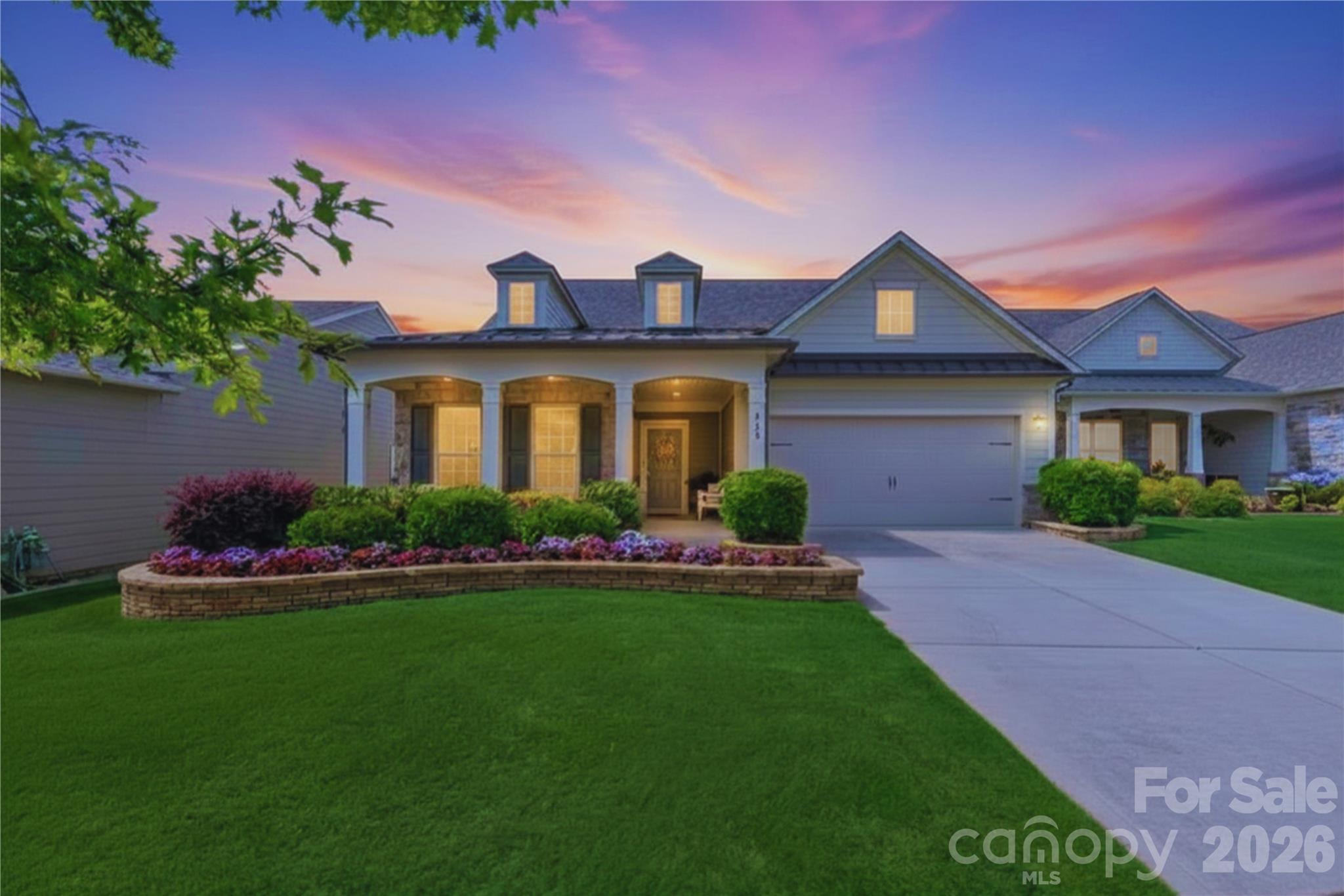 Welcome to one of the newer homes in highly sought-after Carolina Orchards, ideally situated at the end of a peaceful cul-de-sac with exceptional privacy and a tree-lined backyard rarely found in the community. Enjoy tranquil views from the sunroom, living room, primary suite, screened porch, and patio, where no neighbor is in sight. The level, flat backyard provides additional outdoor enjoyment and flexibility, while professionally designed flowerbeds, attractive hardscaping, and enhanced exterior landscape lighting create beautiful curb appeal both day and night. Combined with the welcoming front porch and secluded backyard, this home offers a unique balance of independence and connection.

Inside, thoughtful upgrades abound, including hardwood floors, custom blinds, floor outlets, and a fireplace highlighted by custom art lighting, serving as a sophisticated focal point in the open-concept living space. A dedicated office with French doors provides the perfect space for remote work, hobbies, or everyday organization without sacrificing living space.

The beautifully updated kitchen is designed for both everyday living and entertaining, featuring matching KitchenAid appliances, a gas cooktop with custom hood, wall oven, designer backsplash, and an expansive eat-in island with built-in bookshelves that keep cookbooks and countertop clutter neatly organized. The refrigerator conveys, along with a gently used Maytag washer and dryer.

The spacious primary is a true retreat with backyard views, custom closet, and an en-suite with a walk-in shower with built-in seating and wide doorways, offering both comfort and accessibility. Additional features include a HVAC filtration system, tankless water heater, termite bond, garage sink, regularly scheduled HVAC maintenance through Morris Jenkins, and Leaf Filter warranty for the gutters, providing peace of mind for years to come.

Located just around the corner from the amenities center and mailboxes, this home offers easy access to the incredible Carolina Orchards lifestyle. Residents enjoy indoor and outdoor pools, hot tubs, eight lighted pickleball courts, four lighted tennis courts, two bocce courts, walking trails, a fitness center, dog park, playground, numerous clubs, and a full-time activities director. Whether you prefer an active social calendar or simply the option to participate whenever you choose, Carolina Orchards offers one of the most vibrant active-adult lifestyles in the region.

Golf enthusiasts will appreciate being just minutes from several renowned courses, including Springfield Golf Club, Fort Mill Golf Club, Tega Cay Golf Club, and Waterford Golf Club. Outdoor enthusiasts will enjoy nearby Lake Wylie and Tega Cay, offering easy access to boating, kayaking, paddleboarding, fishing, waterfront dining, and year-round recreation. Residents also enjoy convenient access to The Springs Farm Market, a local favorite for fresh produce, baked goods, seasonal events, and community gatherings.  Anne Springs Close Greenway is also nearby, providing access to more than 2,100 acres of preserved land with trails, equestrian facilities, kayaking, a dog park, and seasonal events. 
Convenient access to I-77 places Charlotte, Charlotte Douglas International Airport, premier shopping, dining, healthcare, and entertainment within easy reach.

Be sure to ask for the latest community newsletter or an amenities tour and discover firsthand why Carolina Orchards continues to be the area's most sought-after active-adult community.