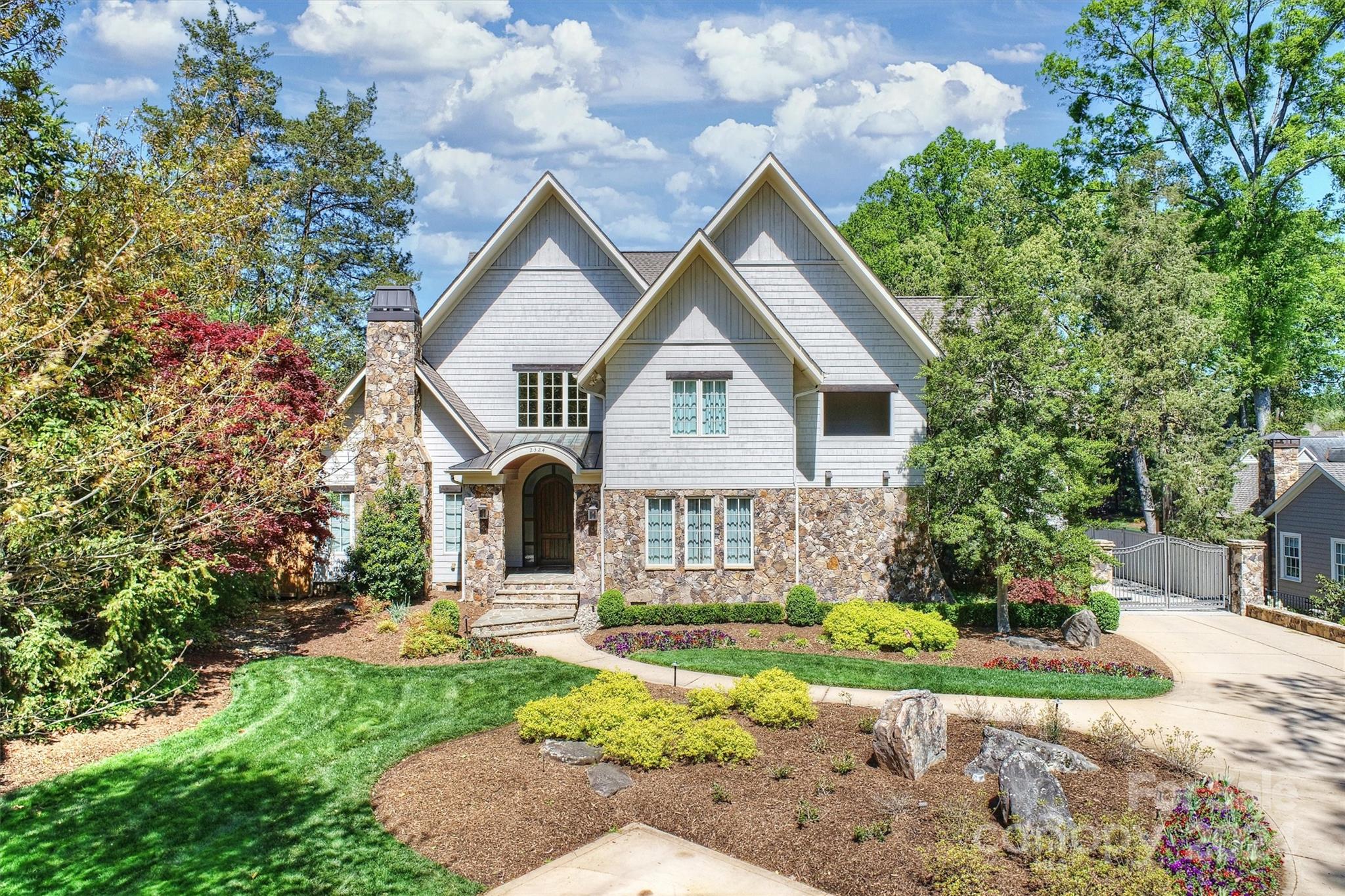 A fabulous, one-of-a-kind home, on nearly 1 acre leveled lot, in one of Charlotte's popular neighborhoods. A backyard oasis for outdoor living offers numerous settings to enjoy throughout the year: loggia for outdoor dining, cabana bar and bath, pergola & fabulous saltwater heated pool w/ waterfall and spa. Cabana has space for a dry spa and already plumbed for new owner's personal upgrade.

Upgrades design by Jim Phelps Collection: remodeled kitchen, piano enclave, & owner's suite upgraded to inc. a retreat area facing a lush backyard & luxurious pool. A true entertainment home: 2nd floor terrace off the rec room; showstopper gourmet kitchen w/ double built-in Sub-Zero refrigerator and freezer, custom-built range hood, top appliances w/multiple ovens, inc a steamer oven. Walk-up attic space ready to accommodate flex space. Expansive rear parking for entertaining. Electric gate for privacy & ease of parking.
Community known as Myers Park, legal description on deed is Pharr Acres.