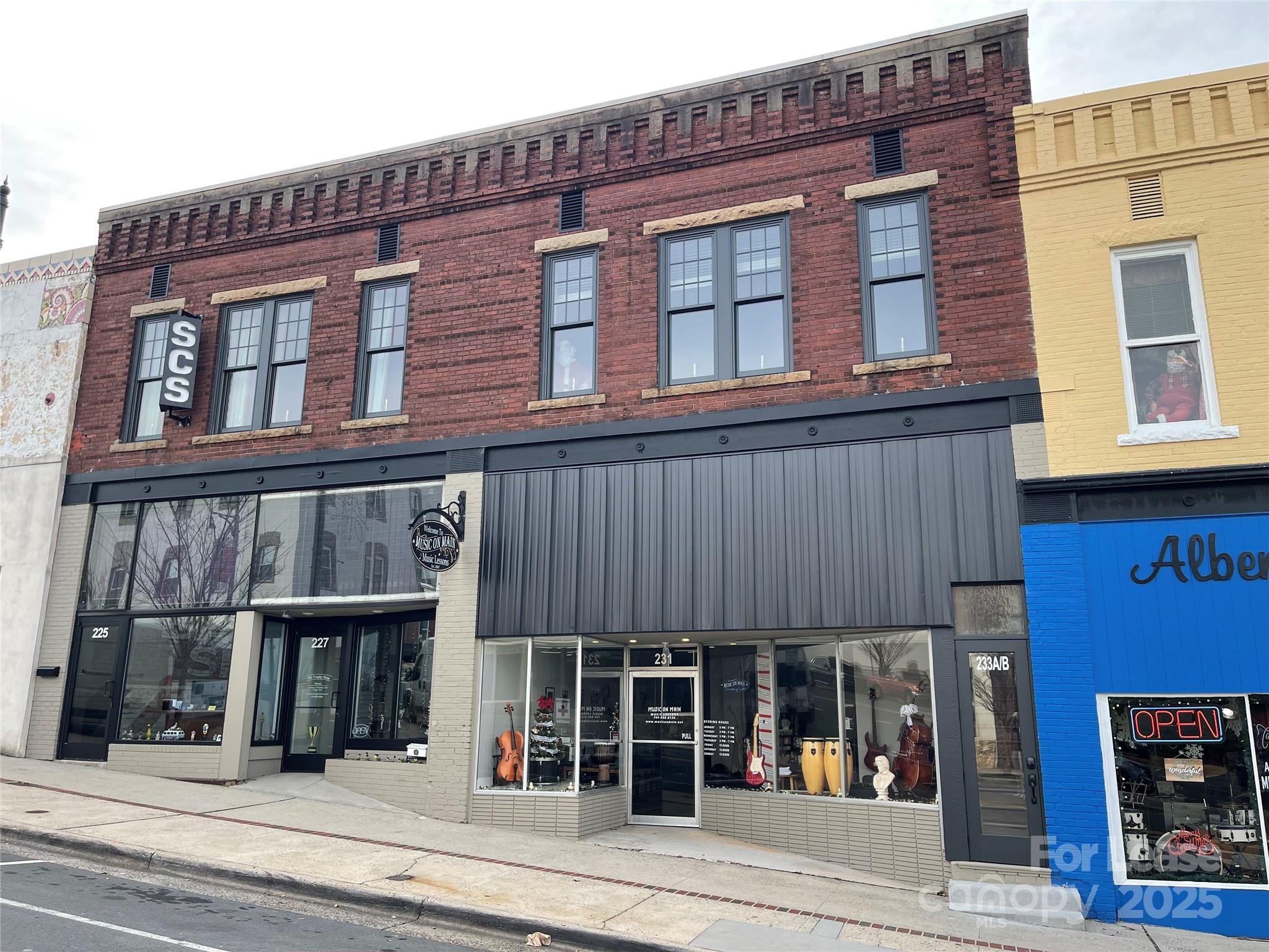 Discover the perfect blend of historic charm and modern convenience in this beautifully renovated 1920s studio loft located in the heart of downtown Albemarle. This upper-level unit has been thoughtfully updated throughout while retaining the character that makes historic properties so special.

The open studio layout features a full kitchen, a spacious full bathroom, and an in-unit washer and dryer for added convenience. Water is included in the rent. Large windows provide abundant natural light and offer views of downtown Albemarle, creating a bright and inviting living space.

This studio is situated in a highly convenient location — approximately 0.3 miles from Pfeiffer University Center for Health Sciences and 1 mile from Atrium Health Stanly Hospital. Downtown dining, breweries, shopping, and other amenities are just below the building, making this an ideal space for those who want a blend of historic character and modern city living.