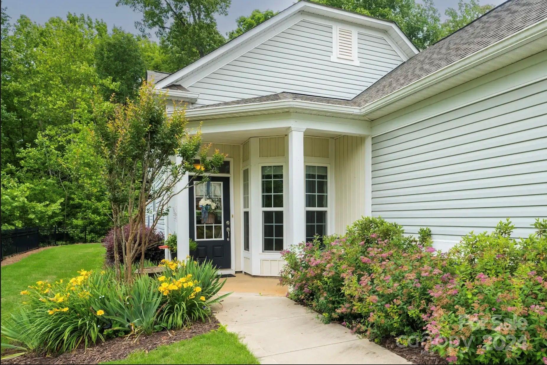 This lovely Pine Springs sits on one of the best premium wooded lots in this amenity-rich active adult community. The home offers 2 bd, 2 ba, office/den/3rd bd with beautiful wood floors and eat-in kitchen. Step into the 3 season porch (with EZ Breeze windows) and out into the amazing backyard with extended patio and pergula. This is an amazing spot to enjoy the wildlife and watch the trees change color. HOA includes yard maintenance, access to amenities, and trash pickup. Come to Carolina Lakes and enjoy your retirement with 2 outdoor pools, one indoor pool, woodworking and stained glass studios, clay tennis courts, pickleball, shuffleboard, bocce, hiking trails, fishing, and 160+ clubs. Convenient access to shopping and medical offices along with low SC taxes. This is a "MUST SEE" home!