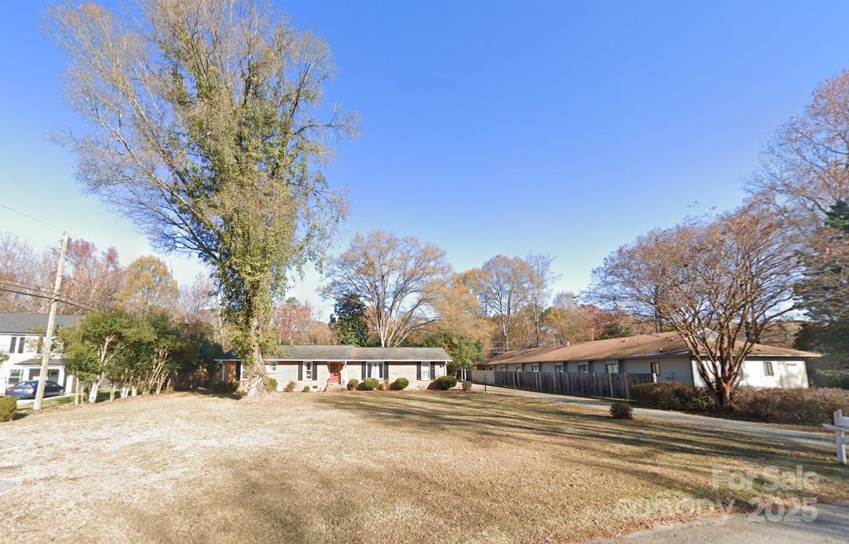 Beautiful brick ranch on 1/2 acre flat parcel is high value land investment zoned for multifamily which allows for future development of a 12-unit, 3-story apartment or condo complex. Prime location is conveniently located to bus line & UNC Charlotte and ideal for development as student apartments or professional condos. Uptown Charlotte, the city’s bustling core, is only 6.5 miles away, offering cultural and employment hubs. Outdoor enthusiasts will love the nearby Greenway for biking and walking, plus recreational spots like Reedy Creek Park. Great local shops, restaurants, bars and services perfectly complement the Urban Charlotte lifestyle. ¾ mi to light rail, 3 mi to UNCC & 12 mi to CLT international airport. With excellent access to I-85 and public transit, this parcel is perfectly positioned for a high-demand multifamily project in one of the Southeast’s hottest markets.
