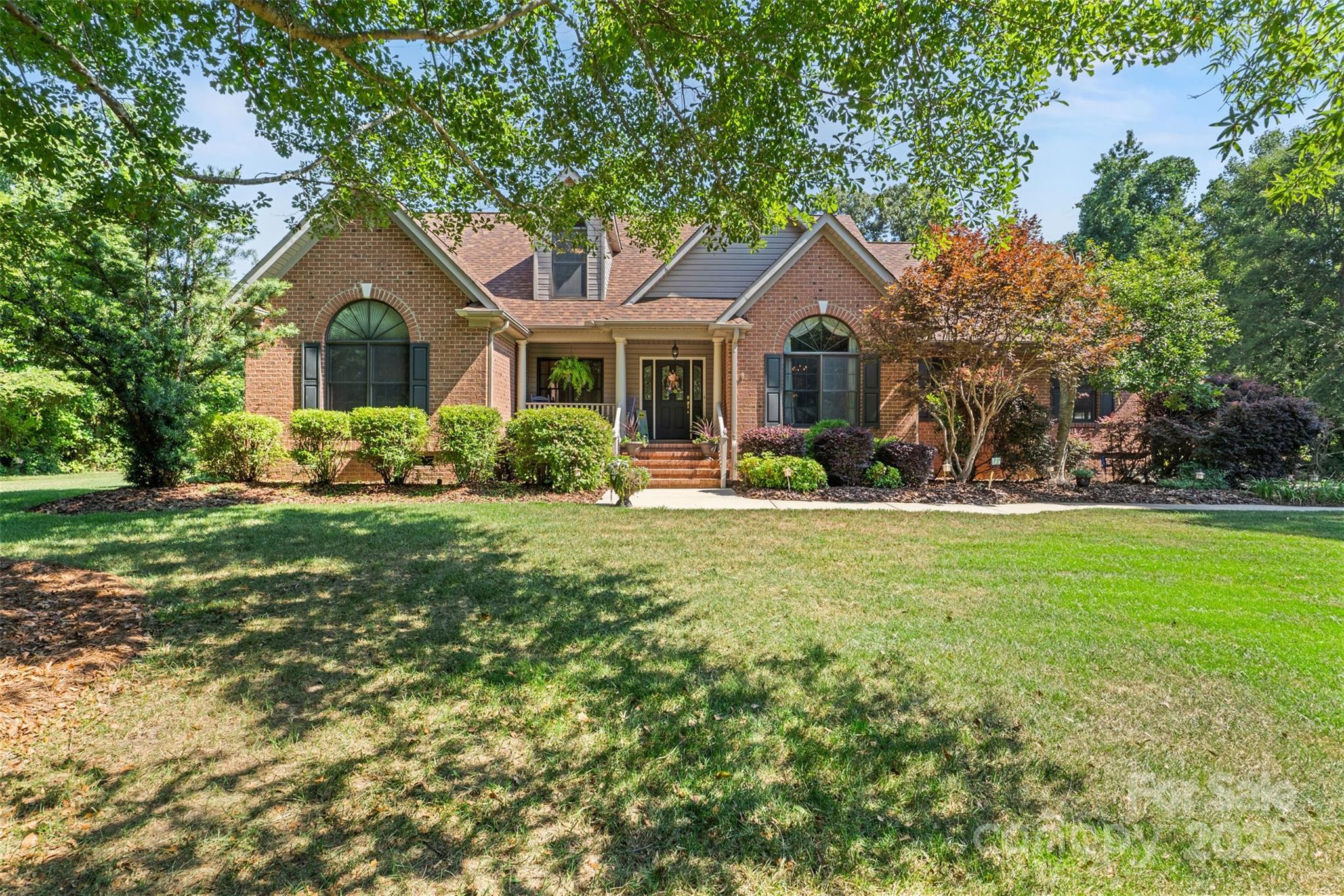 Privacy and Convenience! Beautifully maintained 4BR/3BA brick and siding home on .92 acres in Miller Pond with 3,276 heated sq ft and outdoor living space. Split floor plan with main-level primary suite, updated kitchen with oak cabinets, updated granite counter tops and tile backsplash, formal dining, family room with vaulted ceilings. Architectural features including crown moldings and arched windows. Upstairs includes 4th bedroom, full bath, loft/flex area, and large finished room over garage. Enjoy the screened porch, private deck, and peaceful very private backyard. Home boasts an attached 2-car garage plus oversized 2-car detached garage/workshop (24'x26') and extra parking pad. Located in Northwestern School District. Charming front porch perfect for swing or rocking chairs. Don’t miss your opportunity to see and own this rare private and peaceful retreat convenient to Rock Hill.