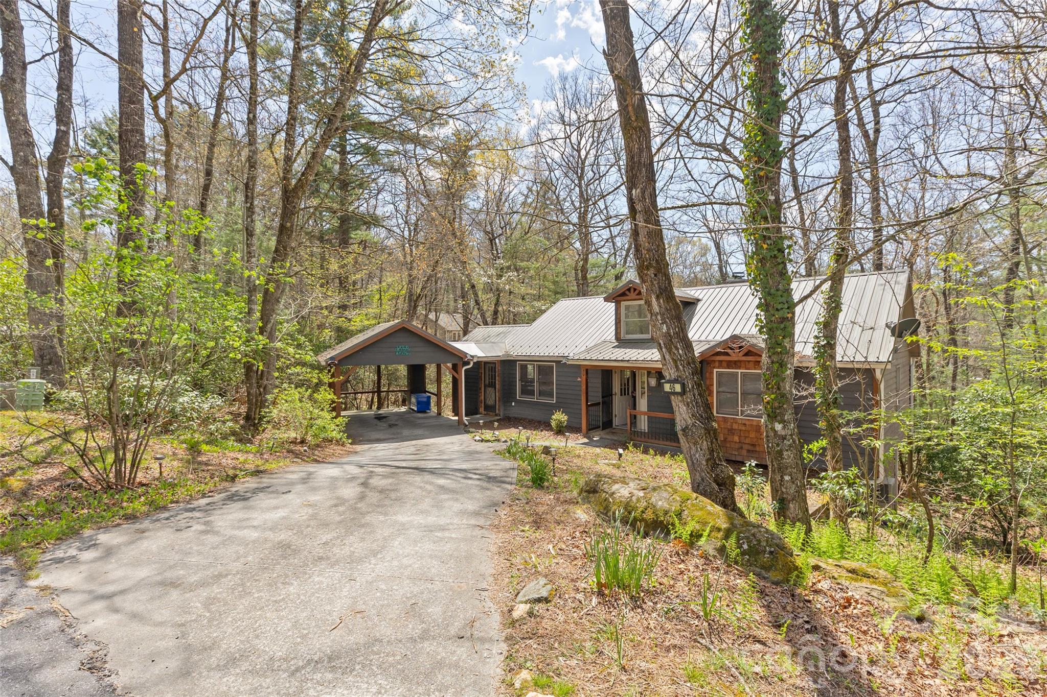Discover this charming cabin in the woods, perfectly situated in the heart of Sapphire. A highly successful VRBO for the current owners, the home is being offered fully furnished and turnkey—so you can begin rental income immediately with no downtime. Tucked on a quiet street with no road noise, it’s close to everything the area offers while still providing a peaceful retreat.

Inside, the open living area is warm and inviting, ideal for cozy evenings and group gatherings. Thoughtful updates and comfortable furnishings create an appealing guest experience, and the flow between the living space and outdoor seating makes entertaining effortless. Outside, private decks and outdoor seating areas offer space to relax and enjoy the forested surroundings and evening breezes.

Homeownership includes access to Sapphire Valley Master Association amenities: pickleball, tennis, indoor and outdoor pools, a rec center and game room, a dog park, and a playground. You’ll also have access to scenic Fairfield Lake for swimming, paddleboarding, or simply taking in the view. Surrounded by lush forests and abundant waterfalls, the location is ideal for hikers, kayakers, and nature lovers.

Just 10 minutes to Crossroads for boutiques, restaurants, groceries, and the Farmers Market, and 15 minutes further west brings you to Highlands’ Main Street with upscale dining and shopping. Conveniently located just over an hour from Asheville Airport, weekend getaways are effortless. Don’t miss this special property—move in, relax, and start enjoying the Plateau.