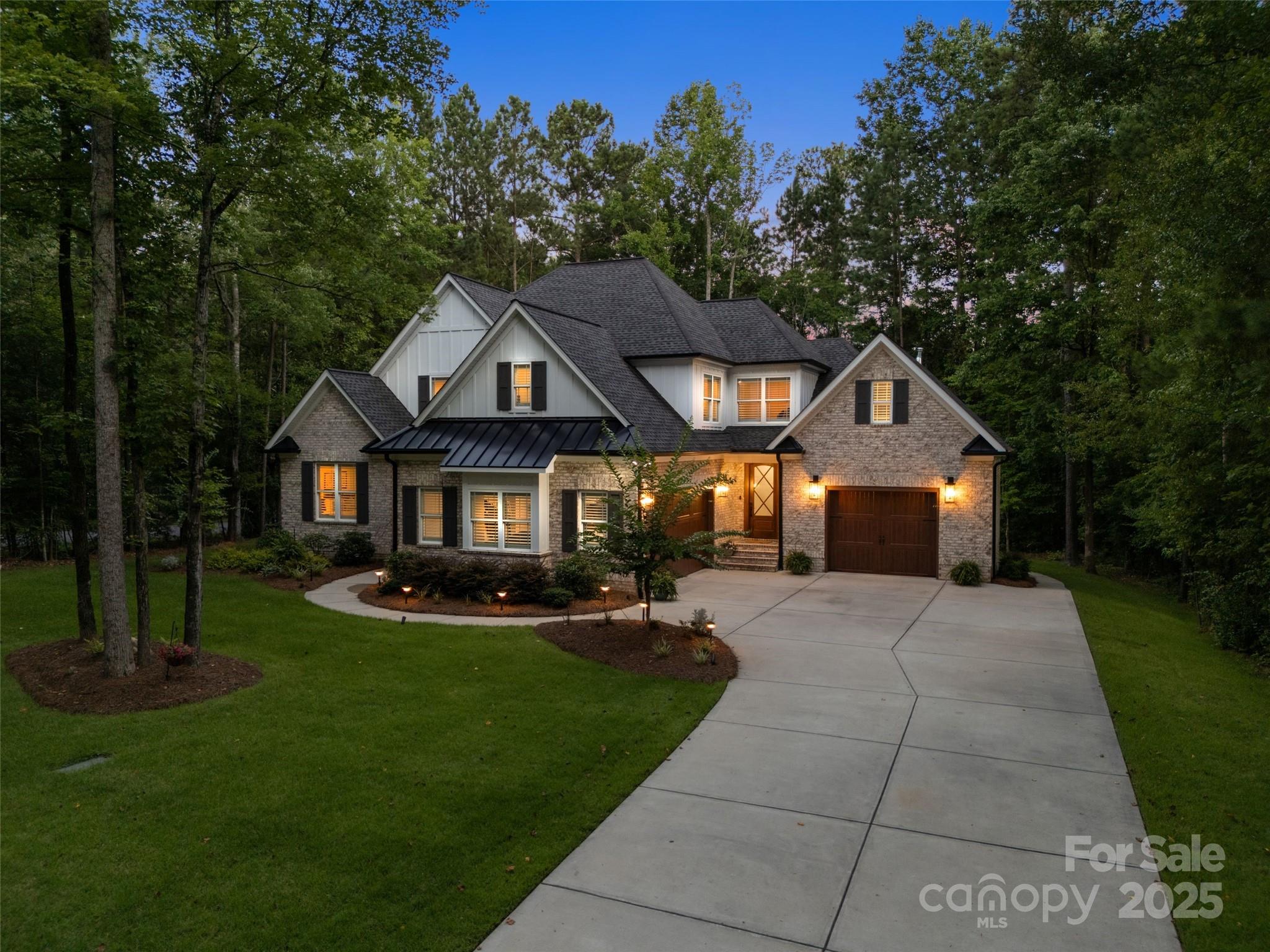 Do you dream of custom building but don’t have the time or energy? If so, this home is for you. Step into timeless elegance with this masterfully crafted 4 bedroom/4 bath custom estate, offering a rare blend of refined design, upscale comfort, and sophisticated details. Every inch of this home exudes luxury, from the custom trim work and coffered ceilings to the exposed brick accents and beautiful hardwood floors. The main level includes a primary suite and spa-like bathroom, a private office, a guest suite, and an open living area that flows onto a screened porch. At the heart of the home, the designer kitchen makes a statement with a substantial island, high-end appliances, curated finishes, and striking lighting. Upstairs you will find two more bedrooms, 2 bathrooms, and a large bonus room. If that’s not enough, this home is located in a desirable community with the neighborhood pool overlooking the lake! This home offers everything you could want and more!