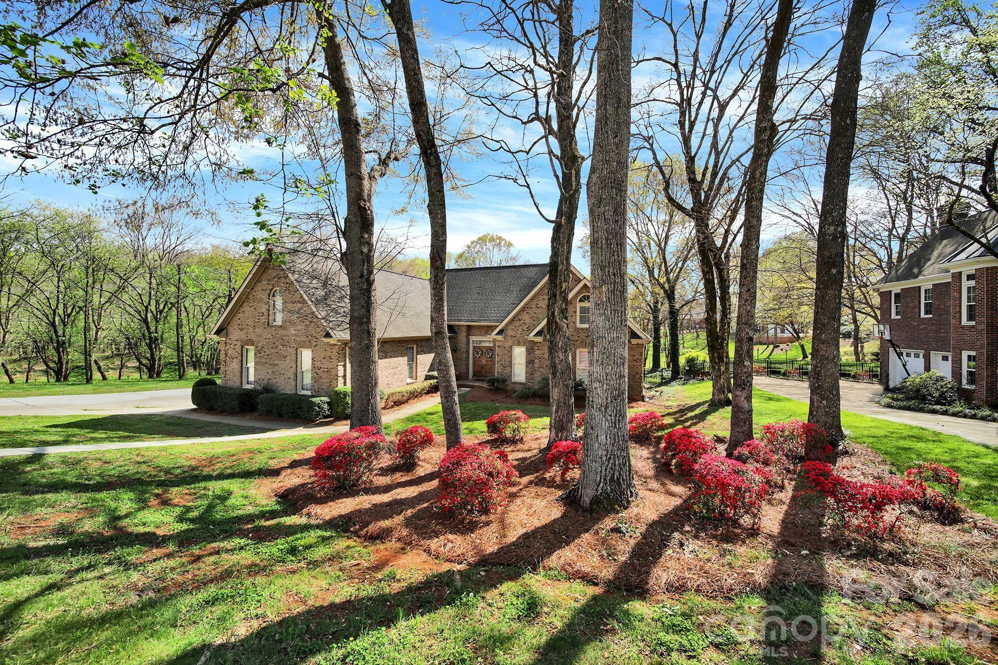 BACK ON MARKET!  You NOW get another chance at this amazing home! Located in highly sought-after Beacon Knoll and bordered by natural area on two sides, this exclusive all-brick side entry 2 car garage home offers 4 bedrooms, 3.5 bathrooms, and a flexible open floor plan designed for modern living. The oversized primary suite ideally on the main level provides convenience and privacy, while a main-level office (currently used as a bedroom) is ideal for remote work, guests, or flex space. The WOW factor is the open-concept kitchen featuring spacious island, tons of cabinetry and flows seamlessly into a sun-filled morning room with large windows, perfect for everyday living and entertaining. A sunken living room with tall ceilings and a wet bar adds architectural interest and creates a welcoming space for hosting gatherings. Finishing out the first floor is a half bathroom and the laundry area. Upstairs, features remaining bedrooms, each with individuality and the fourth bedroom/bonus room with a full bathroom offers a private retreat ideal for a 2nd Primary, guest suite, teen suite, or media room.  Walk-in attic with access from the bonus room provides incredible storage.  Don't wait - schedule your showing today!
