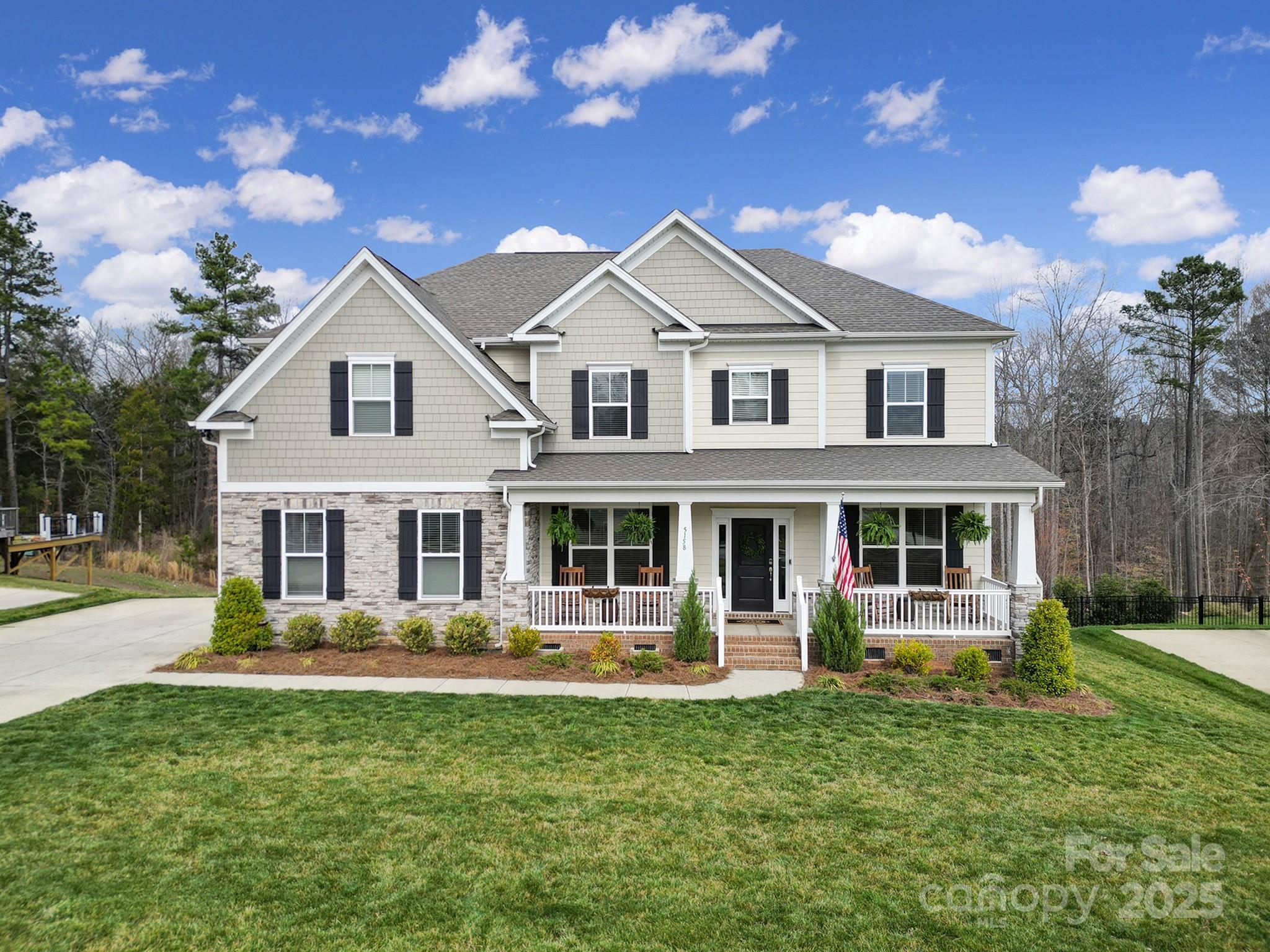 This stunning 2022-built home shows like a model, featuring an open floor plan, 9ft ceilings, LVP on the main level, tankless water heater, epoxy garage floors, and a stunning screened porch. The main floor features a gourmet kitchen with quartz countertops, a five-burner gas cooktop, under cabinet lighting, walk in pantry, and stainless-steel appliances, an office with french doors, a formal dining room, a cozy breakfast area, and a warm inviting living room with a gas vented fireplace. A bedroom and full bath on the main level for guest or your growing family. Upstairs, the spacious owner’s suite boasts a walk-in closet, a tile shower, and a soaking tub. Three additional bedrooms, two full baths, a laundry room, and a versatile loft complete the second level. Enjoy outdoor living from the rocking chair front porch, the expansive screened porch or rear deck overlooking a private, tree-lined backyard. Welcome home!