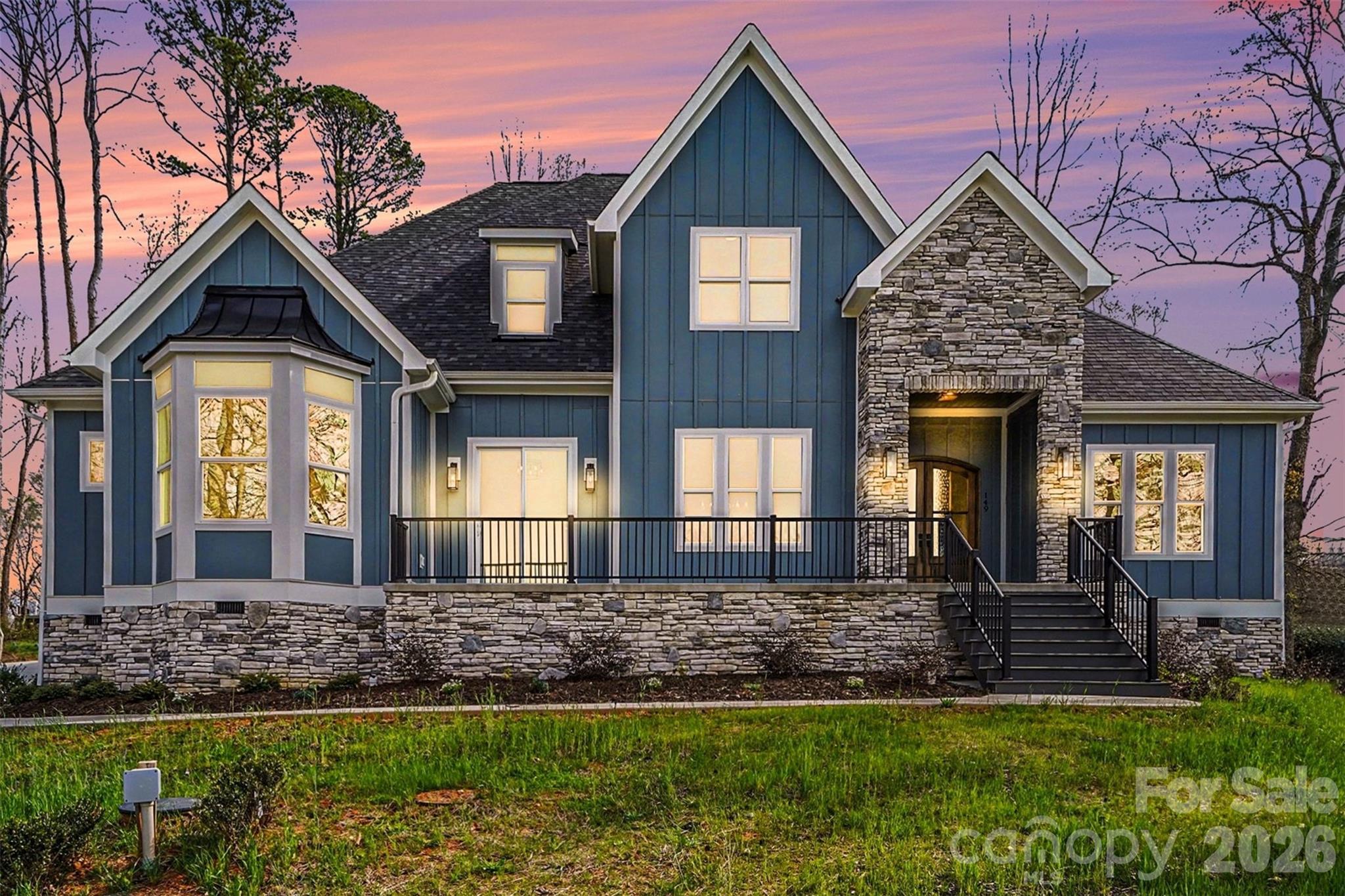 Experience elevated luxury living with year round Lake Norman water views in this stunning, expertly crafted new construction home in Shady Cove, showcasing exceptional attention to detail throughout. Completed in 2024, this exquisitely designed new construction residence offers over 4,000 square feet of refined living space with 4 bedrooms and 4 baths, blending timeless design with modern comfort.

The main level unfolds with an open, light filled layout that seamlessly connects the living, dining, and kitchen spaces, complemented by a private home office. At the heart of the home, the designer kitchen features premium appliances, an oversized island with leathered finish granite, custom cabinetry and a layout tailored for both effortless entertaining and everyday living.

The main level primary suite offers a private retreat, complete with a sitting area, direct access to a terrace overlooking the lake, and a spa inspired bath featuring an oversized walk in shower, soaking tub, and elegant finishes. Upstairs, generously sized secondary bedrooms and an oversized versatile multi purpose room provide flexibility for guests, work, or leisure.

Outdoor living is equally inviting with a covered patio and 2 minutes to Safe Harbor Skippers Landing Marina, offering easy access to Lake Norman. Situated on a .57 acre homesite with no HOA and a 3 car garage, this home combines privacy, space, and convenience just minutes to Mooresville.

A rare offering that captures the essence of Lake Norman living. Preferred lender offering lender credits toward closing costs.
