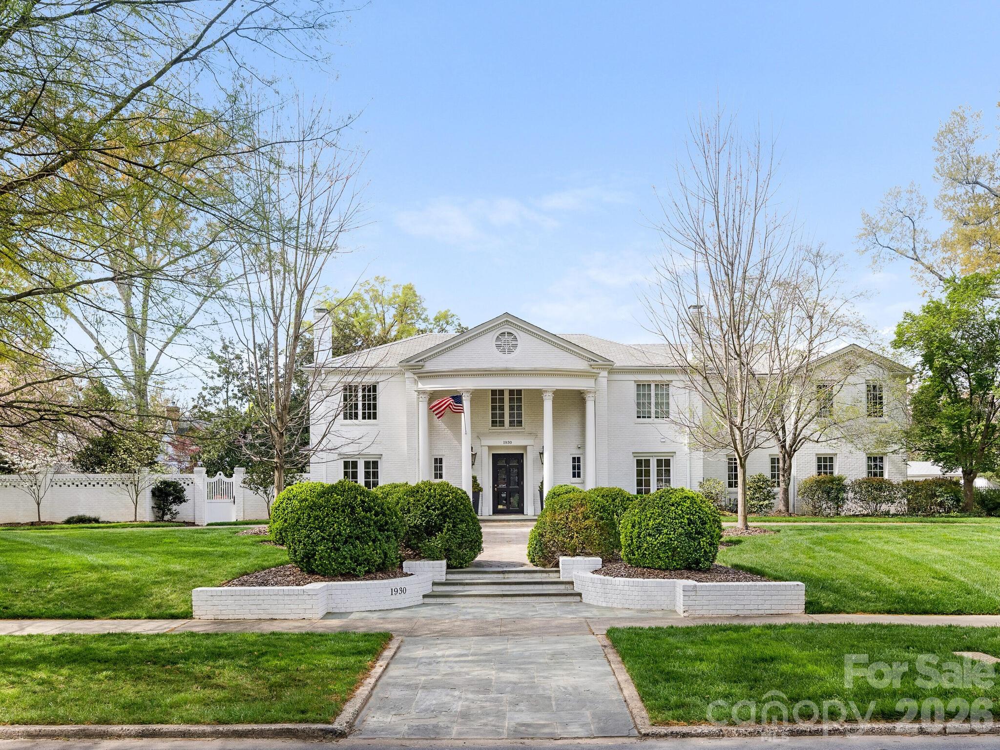 This classic home in sought after Myers Park is on a rare double lot that is just under one acre. The 7,300 sq ft main house includes 6 bedrooms, 5 full baths, and 3 half baths. Scullery located off of kitchen with additional refrigerator and plenty of storage.  Guest/Pool house built in 2021 features 1 bedroom, 1.5 baths, a full kitchen, and an upstairs gym overlooking professionally landscaped rear yard and gardens. Gracious formal areas, high ceilings, hardwood floors, crown molding, custom built-ins, and marble finishes. Large windows provide great natural light and views of treelined Queens Road West and the beautiful outdoor spaces.   Covered outdoor sitting area with fireplace and additional dining area.  The home has amazing outdoor living complete with pool, spa, and multiple entertaining spaces including expansive lawn with turf and gazebo. 2 car garage with ample additional parking and circular drive. Control 4 system. Elevator. First and second floor laundry locations. Close to retail, shops and nearby Freedom Park.