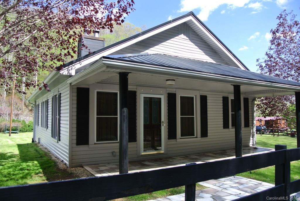 1388 sq.ft, 3-BD/1-BA Home –PLUS a -2256 sq. ft Store Building- PLUS- 2-Car garage with work shop area Plus several large storage buildings; Home in great condition with spacious kitchen, covered porch, full basement; near NC/TN State Line great area for business opportunity; Borders BOLD Spring Creek; level yard with apple orchard, grape arbor and garden space; a premium package-for the $$$; would make great artist studio and gallery; easy access and great exposure for any business venture;