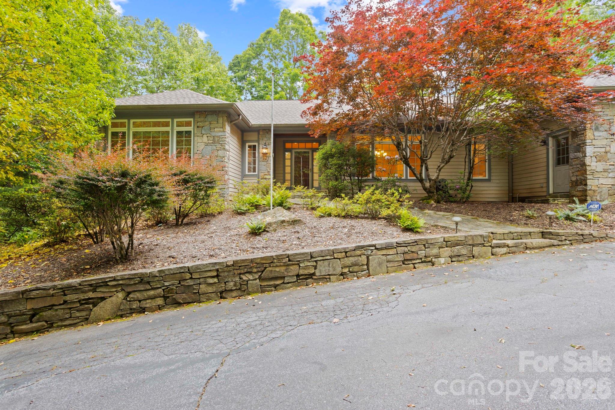 Stunning home situated on 1.48 private acres in highly desirable Kenmure- a gated golf course community. Gorgeous landscaping, fenced backyard and circular driveway. The expansive main level boasts open floor plan, great room w/ cathedral ceiling, floor to ceiling stone fireplace flanked by built-ins, wall of windows, spacious kitchen w/ island, prep sink, double ovens, breakfast room, dining room w/ tray ceiling, primary suite w/ large custom designed walk-in closet & island, dressing area w/ vanity, double vanity in bath, whirlpool ,walk-in shower and 2 linen closets, guest bedroom (would also make a great office) and full bath, laundry room w/ sink, folding table and cabinetry. The lower level features a family room with floor to ceiling stone fireplace, fantastic study with built-in bookcases, guest bedroom, bonus room, 2 full baths and cedar closet. Great outdoor living w/ expansive deck & awning, screened porch and LL patio. Pet friendly. Generator, 2 car plus golf cart garage.