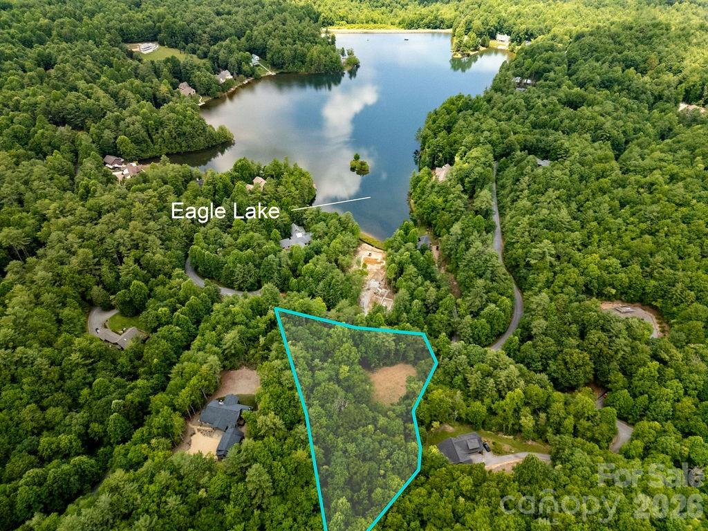 Build the mountain home you've always imagined on this exceptional 2.04-acre homesite in the sought-after Eagle Lake community. Already cleared with a driveway in place and featuring a beautiful stream, this property offers an ideal setting to begin your next chapter surrounded by the natural beauty of Western North Carolina. An expired well and septic permit provides a helpful starting point for future development.

Located less than 15 minutes from downtown Brevard, you'll enjoy the perfect balance of peaceful mountain living and convenient access to shopping, dining, the Brevard Music Center, and the area's renowned outdoor recreation, including DuPont State Forest and Pisgah National Forest.

As a resident of Eagle Lake, you'll have access to outstanding community amenities centered around the private 32-acre lake, including fishing, kayaking, canoeing, paddleboarding, swimming, a sandy beach, dock, floating dock, gazebo, bathhouse, playground, boat storage, fire pit, and green spaces. Whether you're seeking a full-time residence or a mountain getaway, this property offers an incredible opportunity to build in one of Brevard's most desirable communities.