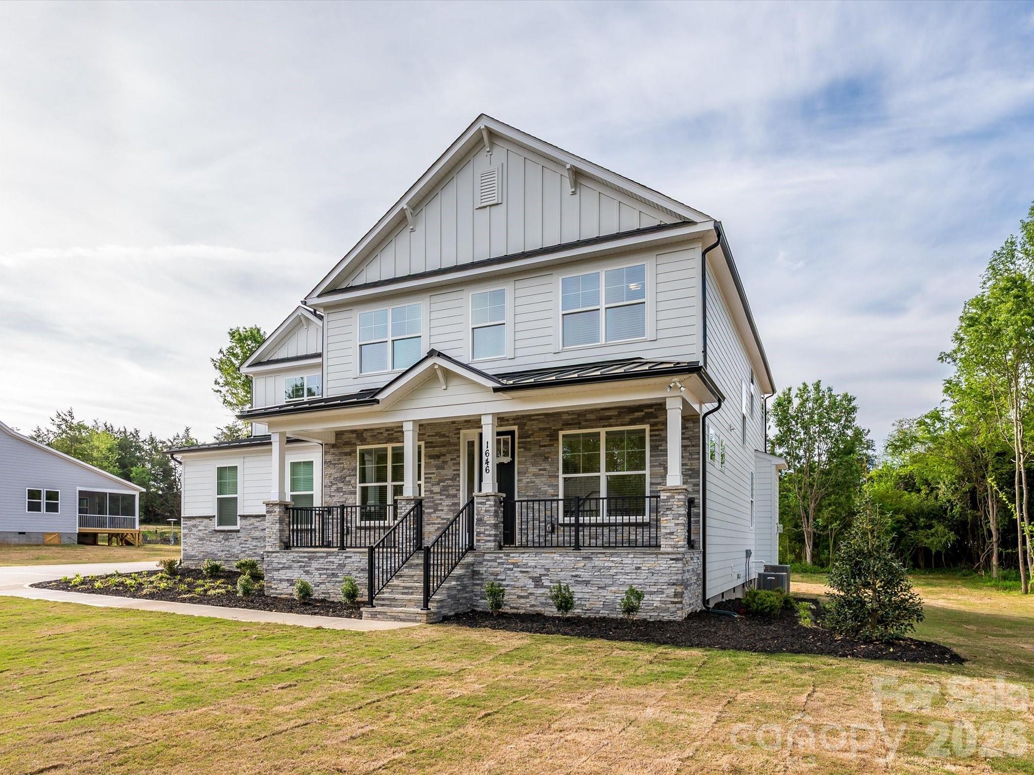 Stunning 2026 custom-built home on over a half-acre lot nestled within the coveted Meadow Lakes II community with no HOA dues. From the covered sitting porch entry, the open floor plan unfolds beautifully with engineered hardwood floors throughout and hardwood stairs. The main floor offers a formal dining room, private home office, sunny breakfast area, AND a guest bedroom complete with its own en-suite bath, thoughtfully positioned off the garage entry for privacy and convenience. The chef’s kitchen features stainless steel appliances, quartz countertops, five-burner gas cooktop, and wall microwave convection oven combo. A farmhouse sink and a generous island with seating and storage make this kitchen as functional as it is beautiful. The walk-in pantry and butler’s pantry with sink and beverage cooler add exceptional storage and entertaining convenience. The breakfast room and formal dining room offer effortless options for every occasion, while a private home office and a convenient drop zone with tech station keep daily life beautifully organized. *The living room and office are pre-wired for surround sound and speakers, adding a seamless entertainment touch throughout the main level. A first-floor guest bedroom with full bath rounds out the main floor perfectly. Upstairs, the expansive primary suite offers dual walk-in closets and a luxurious en-suite bath featuring separate vanities, an oversized shower with bench, and a soaking garden tub. It's pre-wired for a TV, making it a true private retreat. The laundry room features cabinets and a sink, making everyday chores a breeze. Three additional bedrooms, one with a private en-suite, a full bath with dual vanities and spacious Loft complete the upper level.  Built with efficiency in mind, the home features a tankless water heater and radiant barrier roof. The INSULATED oversized three-car garage also has a utility sink providing functional and abundant space for vehicles, hobbies, and more. End your evenings on the screened back porch that is wired for a tv and overlooks a peaceful tree line. The half-acre tree-lined lot, large enough to accommodate a future pool, offers amazing outdoor living potential. Brand new and move-in ready with every detail thoughtfully considered; this is the one you have been waiting for! Home is not part of the neighborhood's HOA and has no HOA dues. Builder home warranty provided. Listing agent is owner.