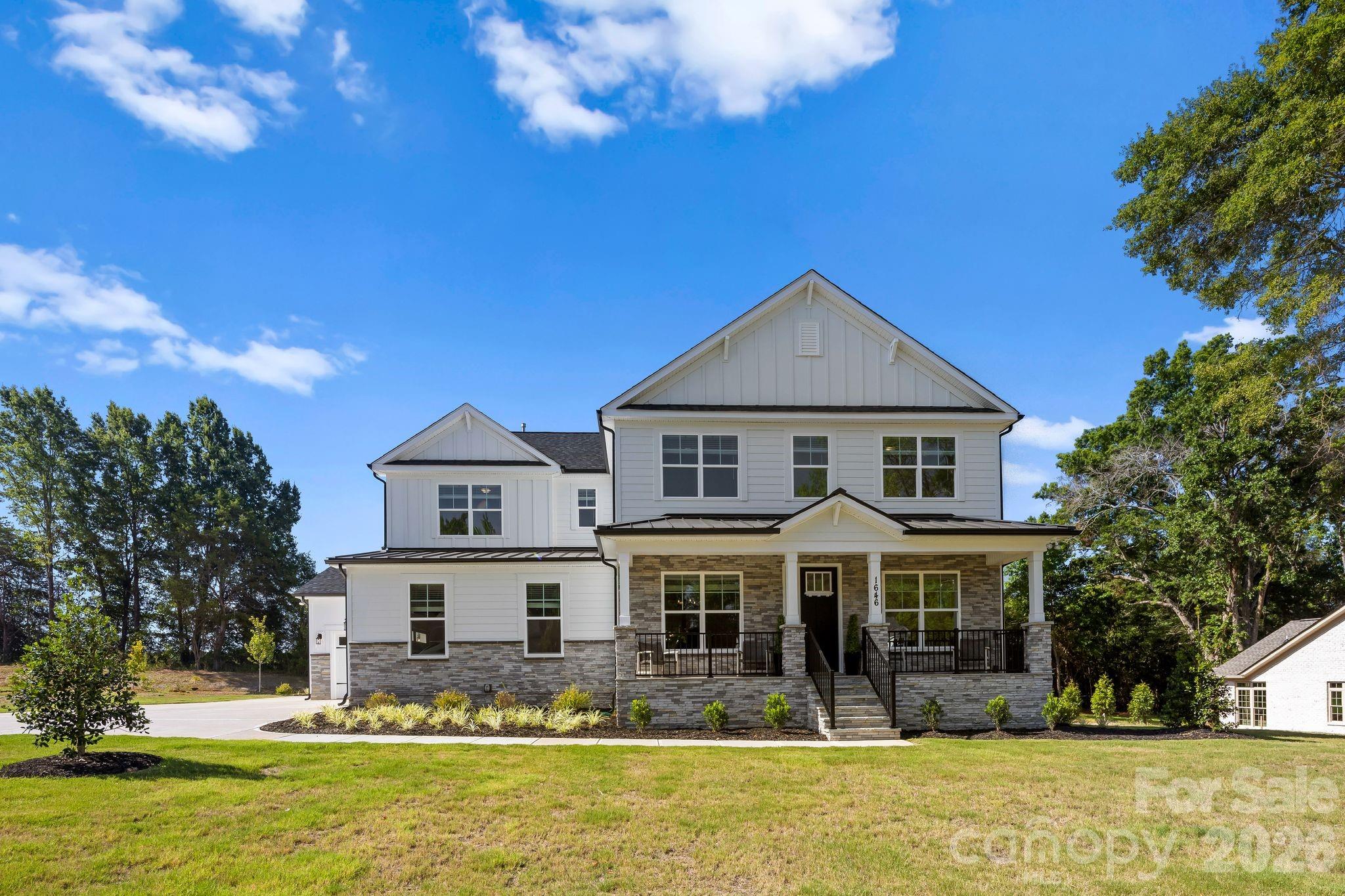 Stunning New Construction home on over a half-acre lot, with the primary bedroom on the second level with a guest bedroom on the first floor and NO HOA. From the covered sitting porch entry, the open floor plan unfolds beautifully with engineered hardwood floors throughout and hardwood stairs. The main floor offers a formal dining room, private home office, sunny breakfast area, AND a guest bedroom complete with its own en-suite bath, thoughtfully positioned off the garage entry for privacy and convenience. The chef’s kitchen features stainless steel appliances, quartz countertops, five-burner gas cooktop, and wall microwave convection oven combo. A farmhouse sink and a generous island with seating and storage make this kitchen as functional as it is beautiful. The walk-in pantry and butler’s pantry with sink and beverage cooler add exceptional storage and entertaining convenience. The breakfast room and formal dining room offer effortless options for every occasion, while a private home office and a convenient drop zone with tech station keep daily life beautifully organized. *The living room and office are pre-wired for surround sound and speakers, adding a seamless entertainment touch throughout the main level. A first-floor guest bedroom with full bath rounds out the main floor perfectly. Upstairs, the expansive primary suite offers dual walk-in closets and a luxurious en-suite bath featuring separate vanities, an oversized shower with bench, and a soaking garden tub. It's pre-wired for a TV, making it a true private retreat. The laundry room features cabinets and a sink, making everyday chores a breeze. Three additional bedrooms, one with a private en-suite, a full bath with dual vanities and spacious Loft complete the upper level.  Built with efficiency in mind, the home features a tankless water heater and radiant barrier roof. The INSULATED oversized three-car garage also has a utility sink providing functional and abundant space for vehicles, hobbies, and more. End your evenings on the screened back porch that is wired for a tv and overlooks a peaceful tree line. The half-acre tree-lined lot, large enough to accommodate a future pool, offers amazing outdoor living potential. Brand new and move-in ready with every detail thoughtfully considered; this is the one you have been waiting for! No HOA. Builder home warranty provided. Listing agent is owner.
