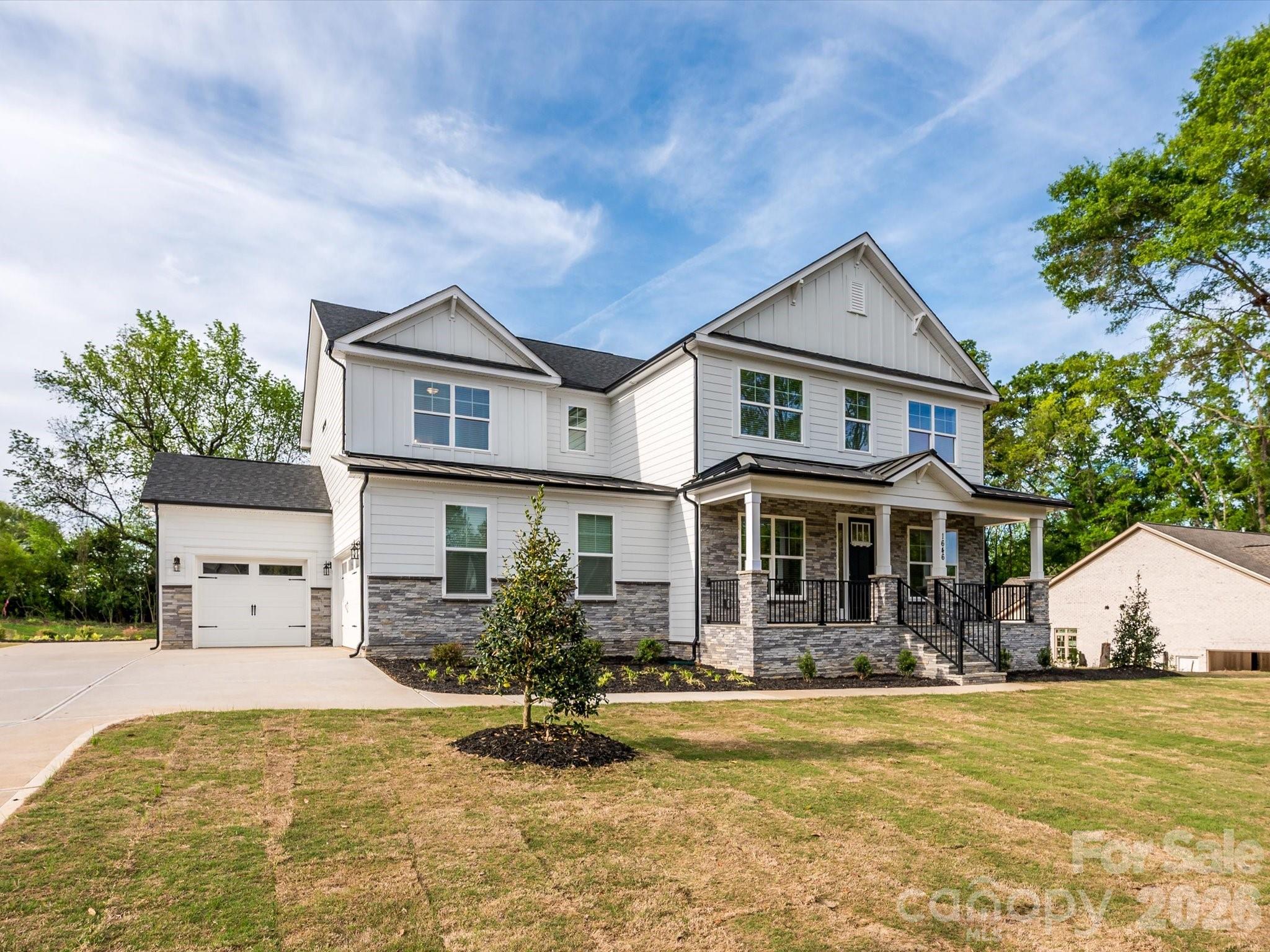 Stunning New Construction home on over a half-acre lot, with the primary bedroom on the second level with a guest bedroom on the first floor and NO HOA. From the covered sitting porch entry, the open floor plan unfolds beautifully with engineered hardwood floors throughout and hardwood stairs. The main floor offers a formal dining room, private home office, sunny breakfast area, AND a guest bedroom complete with its own en-suite bath, thoughtfully positioned off the garage entry for privacy and convenience. The chef’s kitchen features stainless steel appliances, quartz countertops, five-burner gas cooktop, and wall microwave convection oven combo. A farmhouse sink and a generous island with seating and storage make this kitchen as functional as it is beautiful. The walk-in pantry and butler’s pantry with sink and beverage cooler add exceptional storage and entertaining convenience. The breakfast room and formal dining room offer effortless options for every occasion, while a private home office and a convenient drop zone with tech station keep daily life beautifully organized. *The living room and office are pre-wired for surround sound and speakers, adding a seamless entertainment touch throughout the main level. A first-floor guest bedroom with full bath rounds out the main floor perfectly. Upstairs, the expansive primary suite offers dual walk-in closets and a luxurious en-suite bath featuring separate vanities, an oversized shower with bench, and a soaking garden tub. It's pre-wired for a TV, making it a true private retreat. The laundry room features cabinets and a sink, making everyday chores a breeze. Three additional bedrooms, one with a private en-suite, a full bath with dual vanities and spacious Loft complete the upper level.  Built with efficiency in mind, the home features a tankless water heater and radiant barrier roof. The INSULATED oversized three-car garage also has a utility sink providing functional and abundant space for vehicles, hobbies, and more. End your evenings on the screened back porch that is wired for a tv and overlooks a peaceful tree line. The half-acre tree-lined lot, large enough to accommodate a future pool, offers amazing outdoor living potential. Brand new and move-in ready with every detail thoughtfully considered; this is the one you have been waiting for! No HOA. Builder home warranty provided. Listing agent is owner.