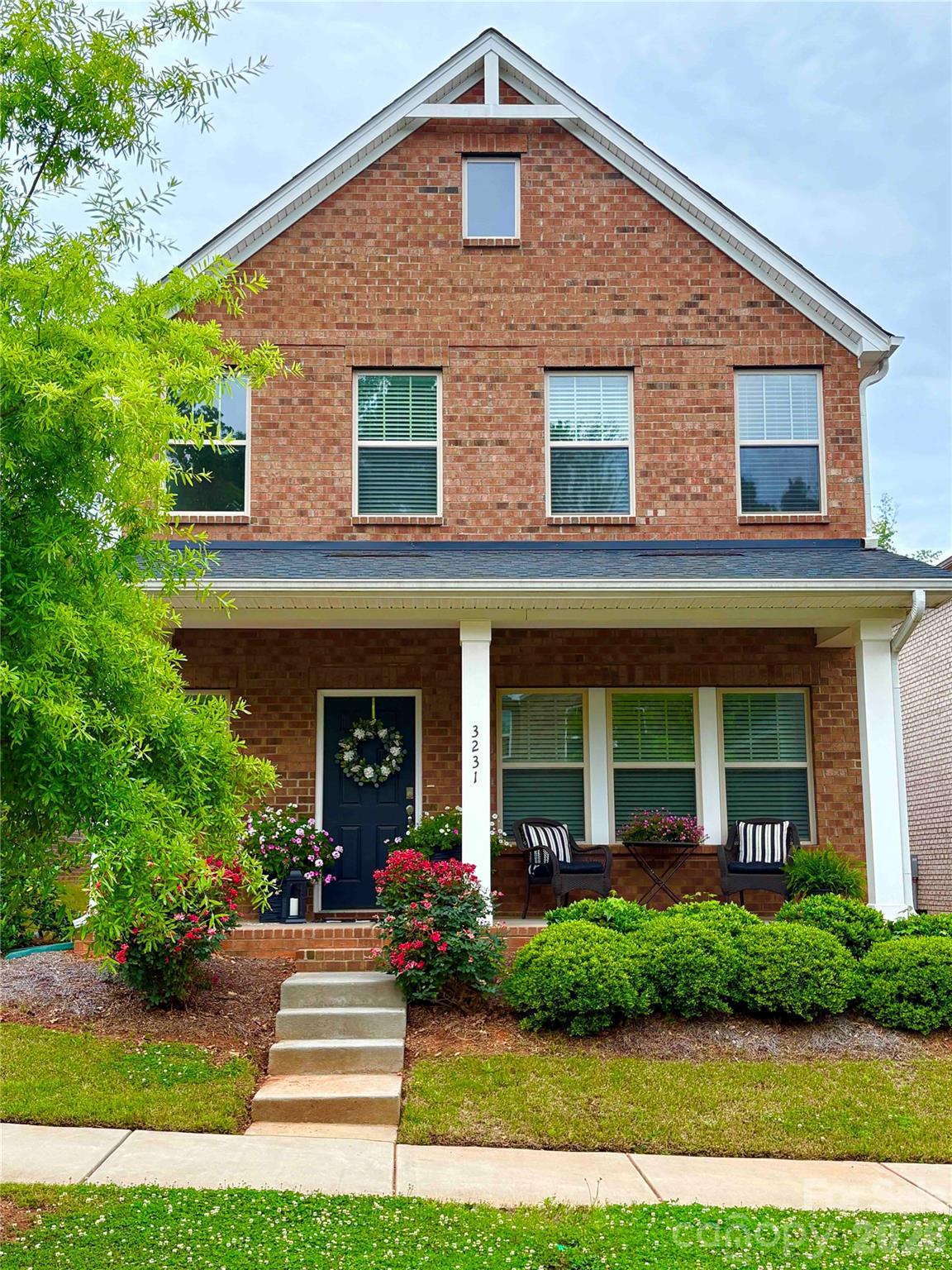 This full-brick 3-bedroom home in Mint Hill Village offers a desirable walkable location near shops, restaurants, and everyday conveniences. The open-concept main level features a spacious Great Room, dining area, and a well-appointed kitchen with white cabinetry, gas stove, pantry, and large eat-in island. A convenient drop zone is located just off the attached rear-load garage.

Upstairs, the spacious primary suite includes a tiled shower, dual-sink vanity, and ample closet space. Two additional bedrooms share an adjoining bathroom, while the versatile loft provides extra recreation, office, or study space.

Outdoor features include a welcoming front porch, charming stone pathway along the side of the home, and low-maintenance full-brick exterior.