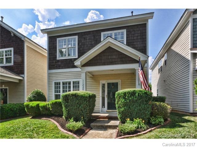 LOCATION, walk or bike to Ballantyne Village and Corporate Park!! updated and adorable cottage stye home in Ballantyne Meadows! 3 bedrooms and 2.5 bathrooms with durable laminate hardwood and slate floors down and carpet up! Granite countertops, crown moldings throughout with all the trimmings! private courtyard style back yard with custom deck and picket fenced lawn! 2 car detached garage, ready immediately!