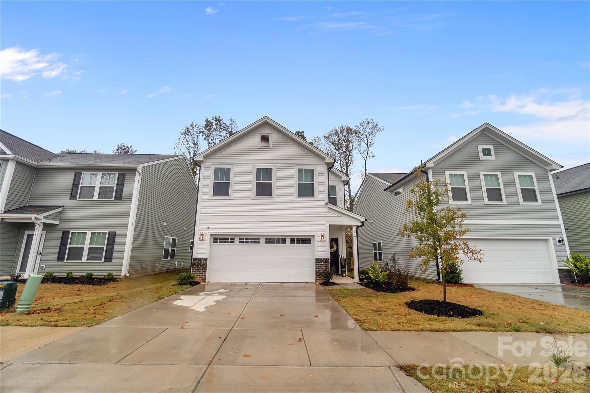 Experience modern luxury in this nearly new, just over a year old home that combines style, functionality, and thoughtful updates. The open floor plan creates a welcoming and spacious environment, perfect for entertaining guests. 
The chef’s kitchen features quartz countertops, a stunning farmhouse sink, and 42-inch cabinets providing ample storage. The large kitchen island and breakfast bar make meal prep and casual dining convenient and social. S.S. appliance being installed at closing brand, offering both quality and aesthetic appeal. Complementing this, all light fixtures throughout the home have been replaced with designer lighting, adding a sophisticated touch.
The first floor is finished with durable, elegant LVP flooring that runs seamlessly throughout, enhancing the home's contemporary look. Escape to the large primary bathroom, featuring a luxurious oversized shower and modern fixtures, providing a perfect retreat. The secondary bedrooms and flexible loft space offer additional comfort and versatility.
Step outside to enjoy a fenced backyard with a spacious back deck—ideal for outdoor gatherings—while enjoying privacy with no rear neighbors and scenic views of surrounding trees. The large laundry room adds convenience, and custom curtains throughout the home create a warm, finished feel.
This home combines premium upgrades with a desirable location, offering a perfect blend of comfort, style, and practicality for modern living.