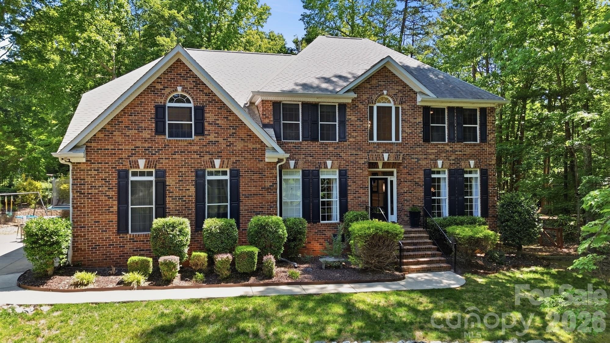 Located in the popular Mint Hill neighborhood of Farmwood East, a quiet, cul-de-sac street leads you to this stunning 5 bedroom, 4 bath home located on a 1.19 acre lot! Step inside to the 2-story foyer where you will find an an elegant formal dining room  and a an office. The foyer leads to the great room featuring a gas log fireplace surrounded by windows that provide plenty of natural light. The great room opens to a well equipped kitchen featuring a large center island with space for bar stool seating,  stainless appliances, walk-in pantry, a spacious breakfast area with plenty of room to host casual family meals and a butlers pantry with  access to the formal dining room. A guest bedroom and full bath are located on the main level offering a private retreat for overnight guests.  Front and back staircases and a conveniently located laundry room completes the main level. Upstairs you will find the primary suite featuring a trey ceiling, generous size walk-in closet, sitting area and a luxurious bath that features a garden tub, walk-in shower, dual vanity and private water closet,3 generous size secondary bedrooms, 2 full baths and a large bonus room. Enjoying the outdoors is easy from the generous size deck that  steps down to the patio and the beautifully landscaped back yard. Additional features and updates include fresh interior paint throughout most of the home, 3 baths renovated in 2024, a 2 car side load garage, and an encapsulated crawl space! Great Mint Hill location  giving you quick access to downtown Mint Hill where you can enjoy walking to outdoor dining spots & farmers market!