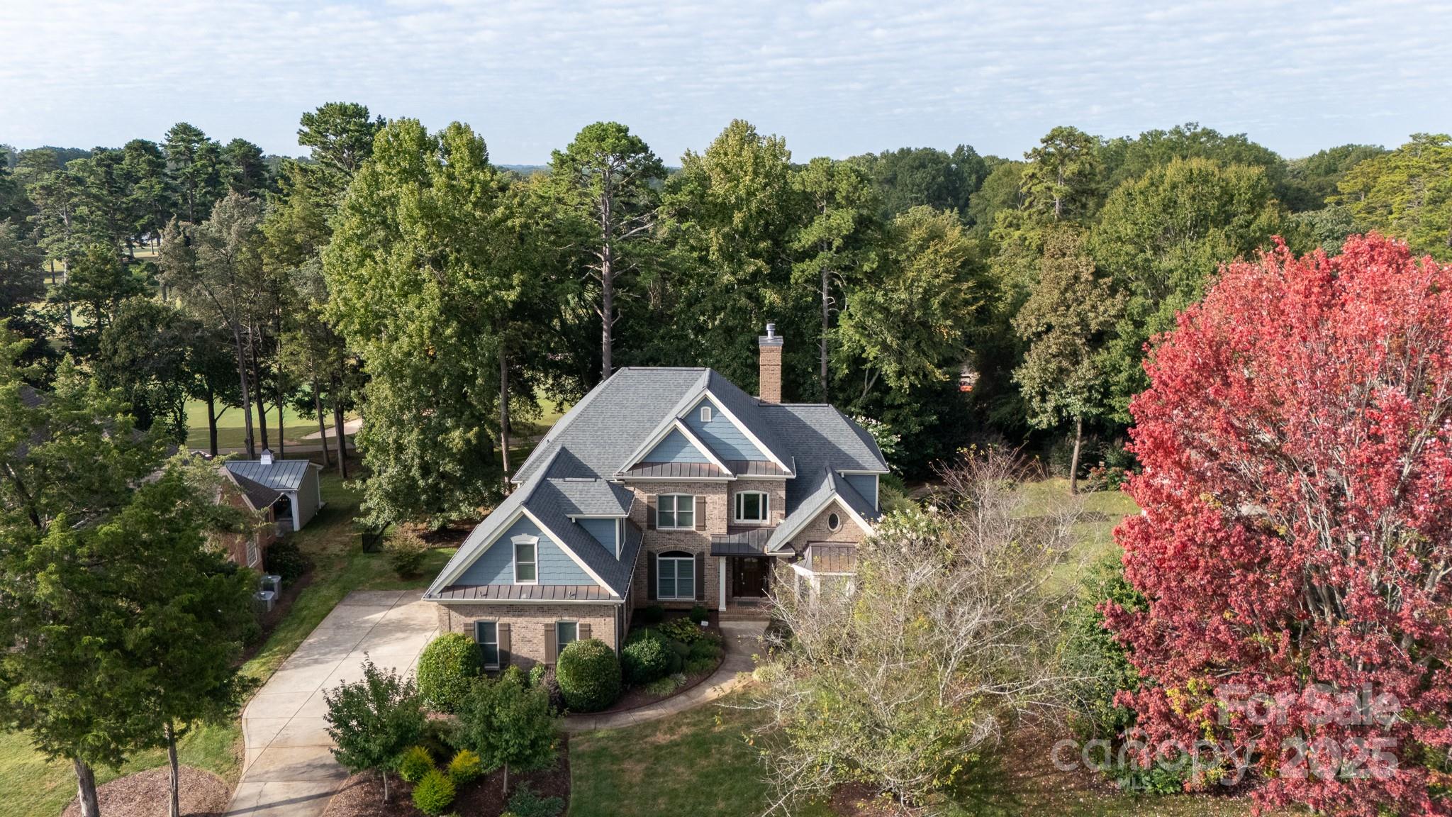 Welcome to your dream home nestled in one of Fort Mill’s most desirable and convenient neighborhoods. Set on the scenic grounds Fort Mill Golf Course, this all-brick custom home offers a blend of spacious elegance and thoughtful craftsmanship across 4,240 square feet. With four bedrooms and four-and-a-half bathrooms, there’s plenty of room and privacy for everyone—guests included.

Step inside to discover beautiful hardwood flooring that runs throughout, coupled with detailed crown molding that adds charm to every corner. The first floor features a dedicated office space that makes working from home a breeze, complete with built-ins for stylish storage. A spacious living area opens effortlessly to a brick patio—the perfect spot to enjoy your morning coffee or host a fun night, with fairway views as your backdrop.

The primary bedroom, located on the main level has his/her custom closets with a luxurious and spacious bath. Each bedroom in this home is designed for comfort and convenience, with full en-suite bathrooms and walk-in closets. That’s right—no need to share sinks or elbow space here. The primary bedroom offers a peaceful retreat, featuring ample natural light and space to spread out at the end of a long day.

You’ll also love the versatility of the huge bonus room—ideal as a playroom, media center, or a second home office if one just isn’t enough. A tankless water heater ensures you’ll have hot water on demand—so go ahead and take that extra-long shower. You’ve earned it.

Beyond the impressive interior, this location is a true standout. You're just steps away from Fort Mill Golf Club, where you can work on your swing or simply enjoy the lush surroundings. Only a short distance away, the Fort Mill Downtown Historic District invites you to explore local shops, charming eateries, and community events. For outdoor fun, Walter Y. Elisha Park offers walking trails, green space, and seasonal festivals.


This home pairs timeless architecture with modern amenities in a location that ticks all the boxes—beautiful, functional, and incredibly well-placed. Whether you're entertaining guests, relaxing solo, or raising a family, this property delivers the room and setting to enjoy every moment.

If you’ve been searching for something that feels a little more refined, a bit more spacious, and just close enough to tee time—this might be the one that checks all the boxes.Families will appreciate being within the highly regarded Fort Mill school system and near Catawba Ridge High School. Daily errands and commuting are simplified by the home's proximity to major roads, while still offering the peaceful seclusion of golf course living.