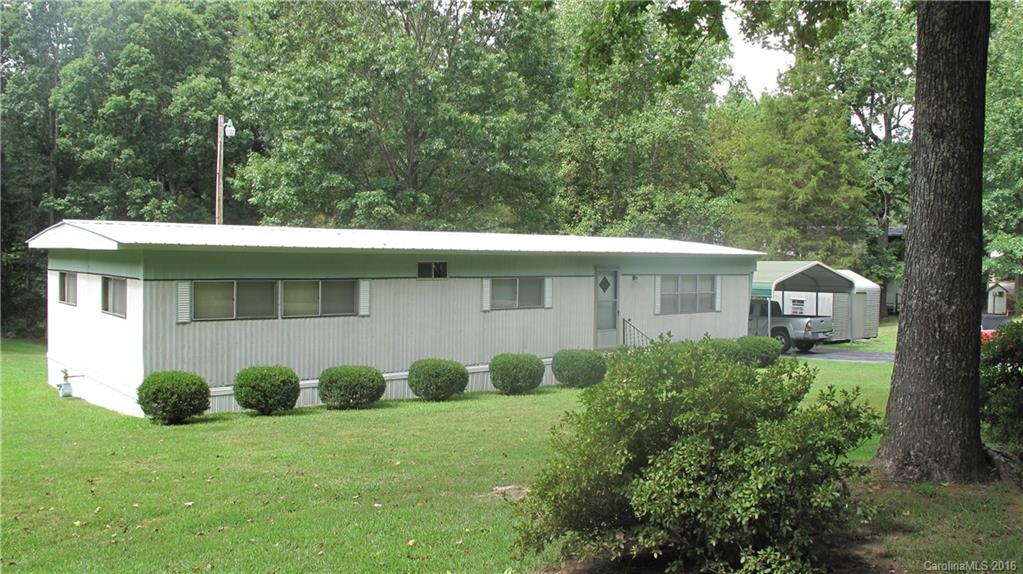 This 3 bed/2 bath home is the perfect place to enjoy the beauty of nature on its large (1.018 acre!) well maintained yard. Enjoy plenty of outdoor storage space in the 3 outbuildings. Interior features include living area, family room, ample closets, & washer/dryer included. Convenient location just minutes to shopping and interstate, yet extremely private. This affordable and move-in ready home won't last long, so come see it today! While inspections are welcomed, property is being sold AS-IS