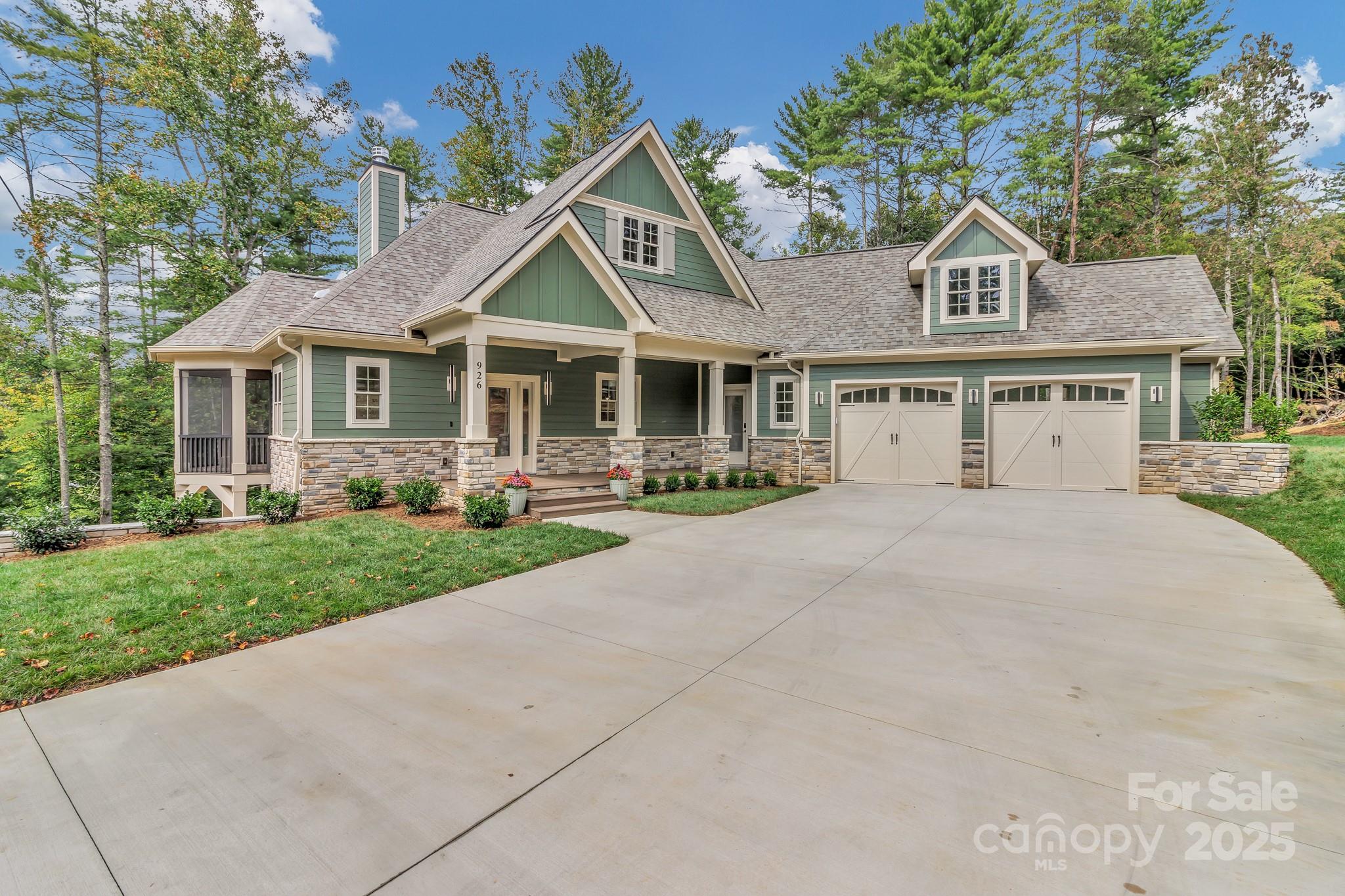 Stunning newly constructed home located in the private, gated community of Settlers Cove, just 10 minutes from Mars Hill, the home of Mars Hill University, and 20 minutes from vibrant Asheville. This 2,530 sq. ft. home offers the perfect blend of mountain charm and modern comfort. The Wesley, designed by Don Gardner, is a thoughtfully crafted two-story home with spacious living areas, natural light, and peaceful mountain living. The main floor features a primary bedroom suite with walk-in closets and a full bathroom. A great room with a wood fireplace is also included with giving access to a screen porch with vaulted ceilings and a rear porch with a cathedral ceiling. The main level also features a kitchen, dining room, foyer and half bath. Skylights brighten the main level living. Downstairs, the walkout basement includes two full bedrooms, a shared full bathroom, and a large recreation room with access to a lower porch and spa area. This home design has everything you need for comfortable mountain living.