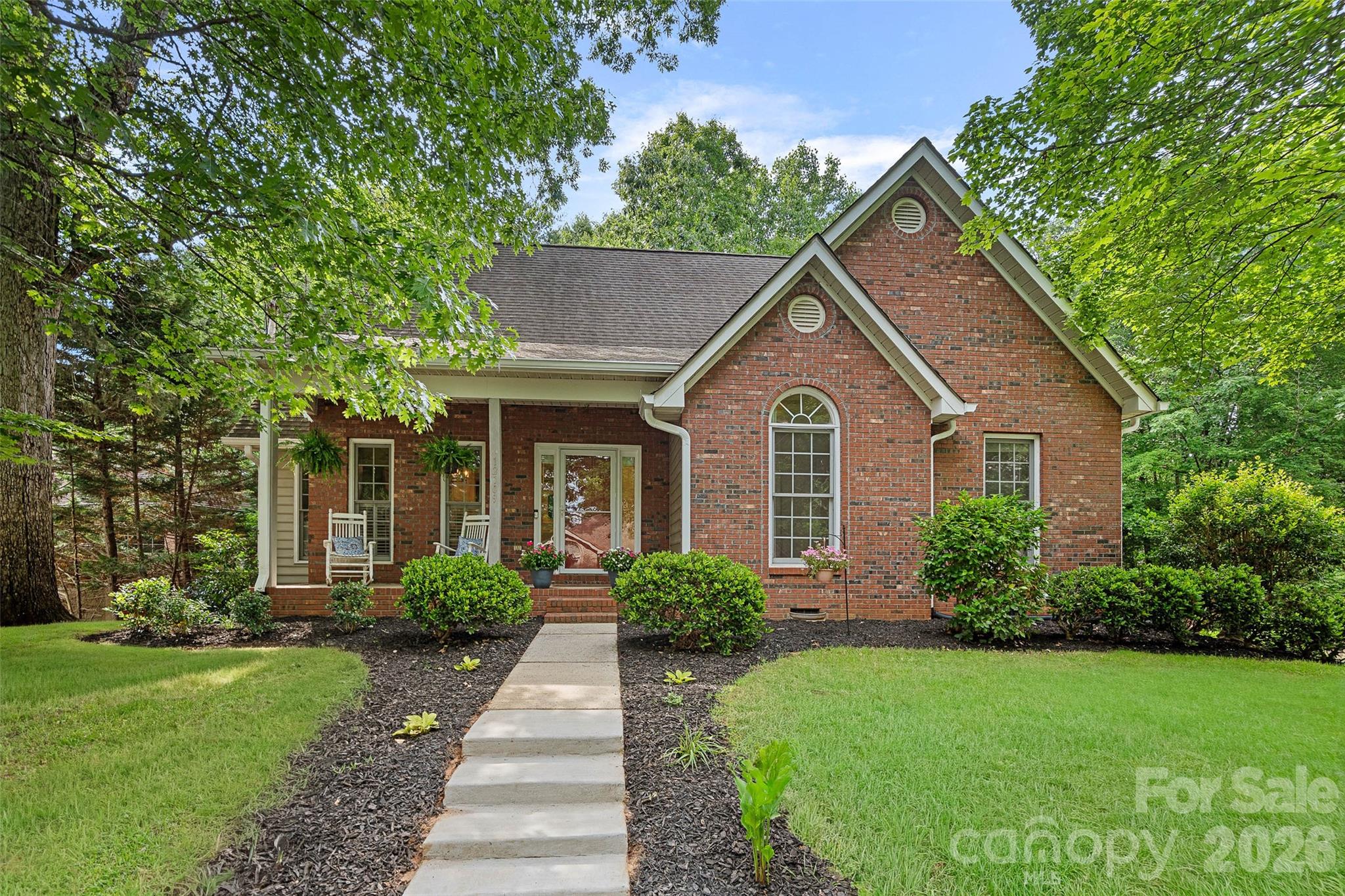 Come experience the peaceful Tega Cay lifestyle in this beautifully updated home! Situated on a desirable corner lot with a flat, fenced backyard, this home offers a bright and welcoming open floor plan designed for everyday living and entertaining. Features include beautiful hardwood flooring throughout the main level, primary suite plus two additional bedrooms on the main level.  The walk out basement boasts durable LVP flooring, large family room, full bath and a flex space currently used as a fourth bedroom.  A bar/entertainment area on the lower level is perfect for entertaining on the large back patio overlooking the private wooded backyard.  Residents of Tega Cay enjoy a unique blend of amenities and natural beauty with walking trails, lake access, parks, golf and year round community events making it one of the area's most desirable neighborhoods!