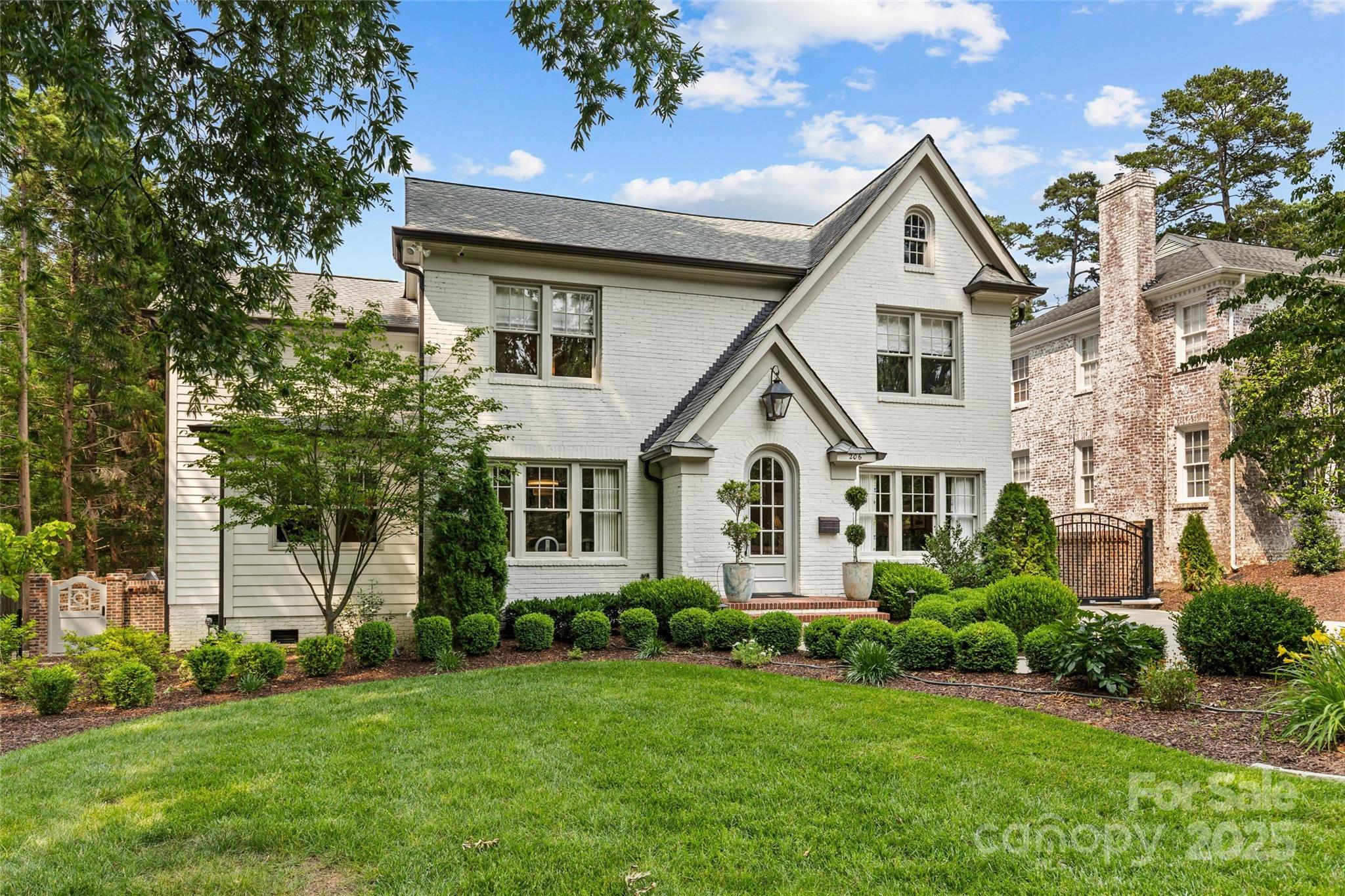 Charm abounds in this impeccably updated 4 bed, 3.5 bath Myers Park home! Set on a flat manicured lot with professional landscaping & brick privacy wall, this home features gleaming hardwood floors, designer lighting and finishes, and a chef’s kitchen with custom cabinetry, quartzite countertops and backsplash, and premium Thermador appliances. Thoughtfully curated and designed spaces include formal living and dining rooms, a cozy den, office/playroom, family room with gas-log fireplace, and a luxurious primary suite with spa-like marble bath and expansive walk-in closet. Enjoy a fully fenced backyard with new bluestone patio, and custom Hillbrook Collections outbuilding/shed. Additional highlights include surround sound, scullery, bar, mudroom, attic/basement storage, and electric gated driveway with widened parking. Just around the corner from nearby shops and dining along Selwyn Ave, with easy access to SouthPark, Uptown, and more. An absolute gem of a home you do not want to miss!