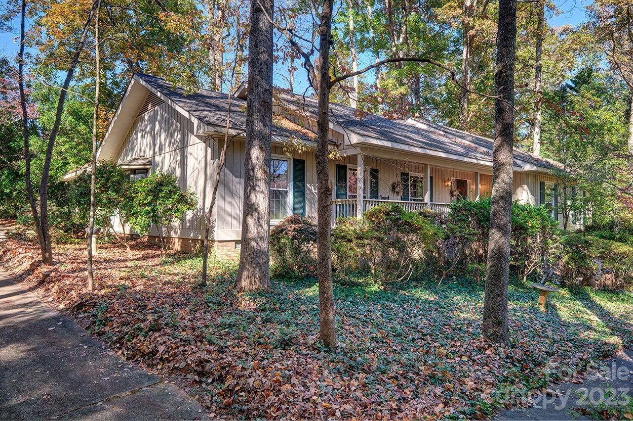 Move in ready RANCH in gated community of River Hills! All hardwood floors throughout entire home!Cozy den with wet bar that opens to 4 season room and also has large living room and formal dining room.  Covered front porch that is length of the house welcomes you to the front door.  Great privacy on a cul de sac within the neighborhood. Some updates have been done but you can make it your own. The bar opens to the kitchen so you don't miss the action. Nice primary suite and 2 other bedrooms round out the floorplan of this ranch. Oversized garage that also offers big workshop with built in work bench. Don't miss the walk in crawl space for additional storage and easy access to the mechanicals. Well cared for home.  Neighborhood offers miles of walking trails, waterfront park with sand beach and picnic pavilion, marina, country club with 18 hole golf course, 24 hour security ,gardens, dog park, playgrounds and more. All this and in the award winning Clover school district. Welcome home!