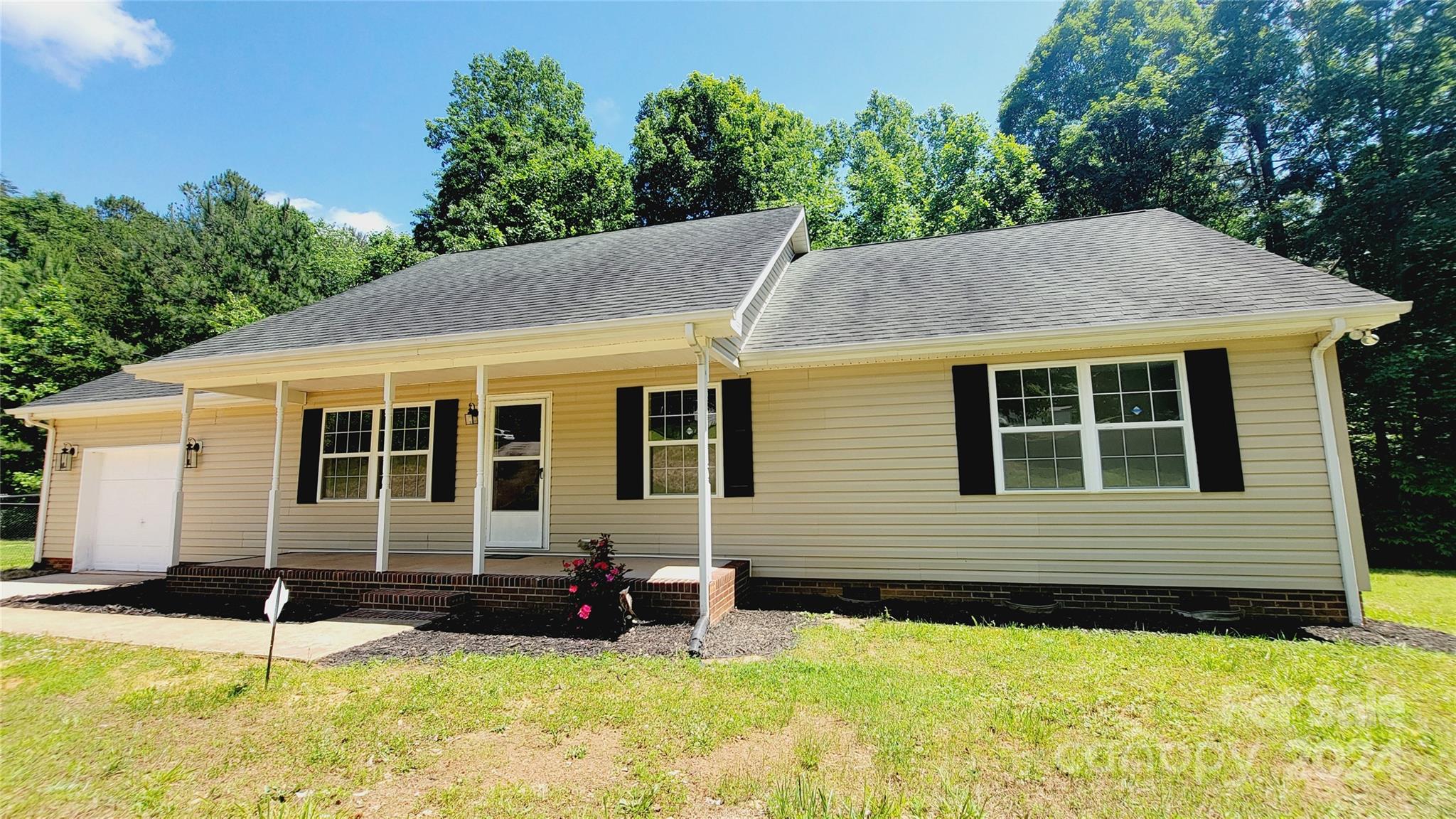 Privately and quietly situated House on a Cul-de-Sac consisting of 3 lots totaling 2.4 acres. Gently sloped front yard is full of lush green grass and on the back and sides surrounded by medium-sized trees. There's a large fenced side yard with an access to the garage; a perfect setting to let your pets roam safely. House has a large front rocking chair covered porch, as well as a large rear deck surrounded by beautiful mid-size tree creating a private and serene setting for those hot summer barbecue parties. Home has been beautifully renovated inside, from new laminate flooring in the Living, Kitchen and Hallway and new higher end carpets in the bedrooms to upgraded kitchen quartz counter, new appliances and hardware. House has also been fully repainted inside, bathrooms updated and new exterior doors replaced. House has a water softener system and a vapor barrier in the crawlspace. Come and see this beautifully renovated home with this amazing location, only minutes from Hwy 321.