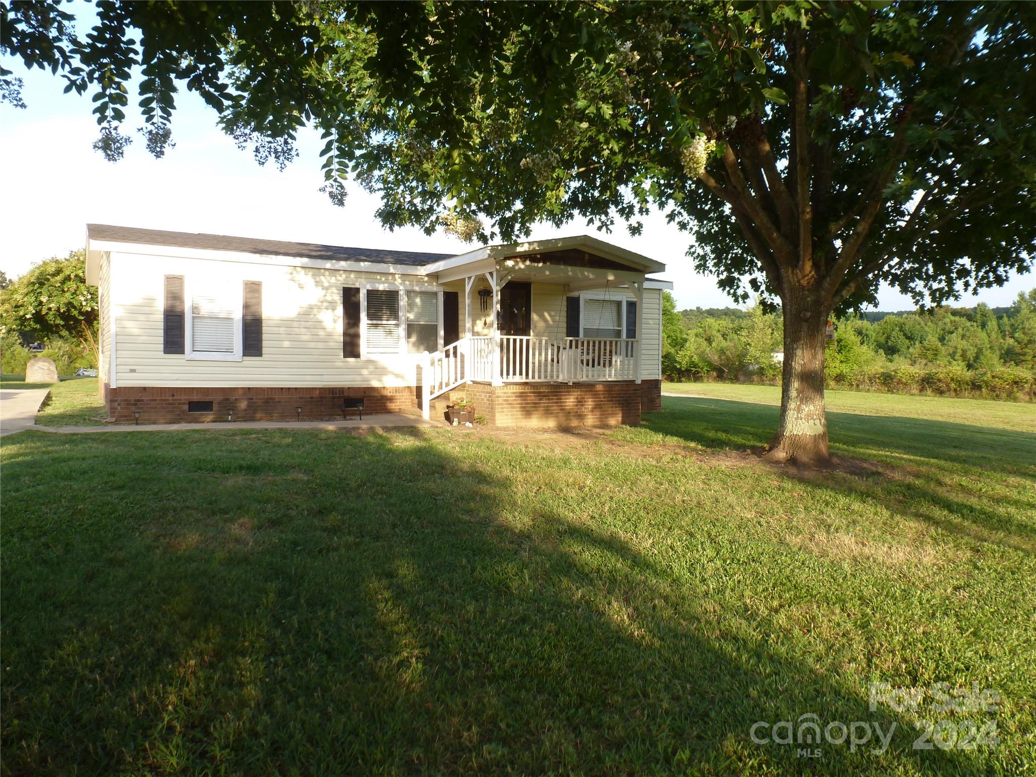Country living with this 3 Bedroom 2 Bath Home on a 1 acre lot.  A beautiful pond in the back yard and a peaceful setting.  New roof and new hvac installed in 2023, all appliances included, front porch and back deck as well.  2 Outbuildings included.  A must see!