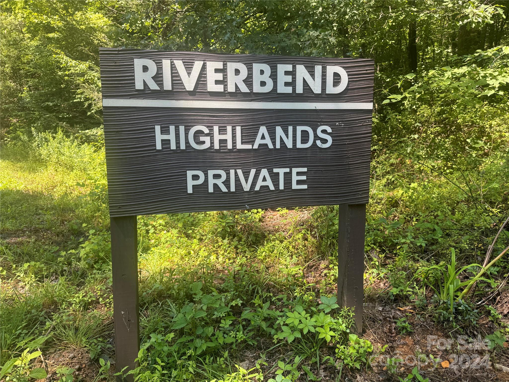 Tranquitliy awaits with this vacant, almost 3 acre parcel, located in the private Riverbend Highlands Community! This property is the idea location for a full time residence, 2nd home or rental property. Located only a couple miles from Vandele Farms on Cedar Creek - which offers family owned farm raised pork, beef, lamb and much more! Just a short drive to 2 championship golf courses, several local restaurants, shopping, Chimney Rock State Park, Buffalo Creek Park, Tryon International Equestrian Center, Asheville, Hendersonville, Black Mountain, The Blue Ridge Parkway, and all the best that Western North Carolina has to offer!