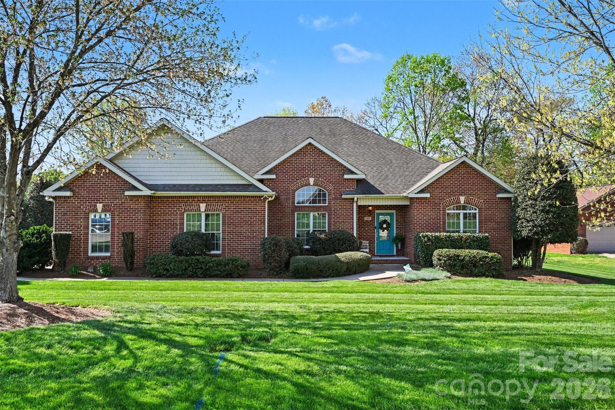 New 40 year architectural roof, new HVAC system, new carpet in all bedrooms, and new primary shower frameless door just completed in this lovely all brick one level home in Spring Forest. Huge open vaulted great room with fireplace and built-ins flows into the breakfast and dining rooms around the central kitchen. 12' x 16' screen porch right off the great room with outdoor TV connection. Timeless 2 inch oak hand laid hardwood floors throughout the living areas. Tile floors in the wet rooms. Split bedroom privacy with the primary bedroom and office on one side and the 2 bedrooms on the other. Todd Ellis built quality home. Small fenced area in backyard is for their dog. Lot extends to tree line at back of property (note the white stake). Quiet community with street lights and walking trail between roads so you can tour the entire community without going on the main road. Ideal location just 3 miles from I-40 exit 154 and a lovely country drive down Highway 64 to the Winston-Salem area.