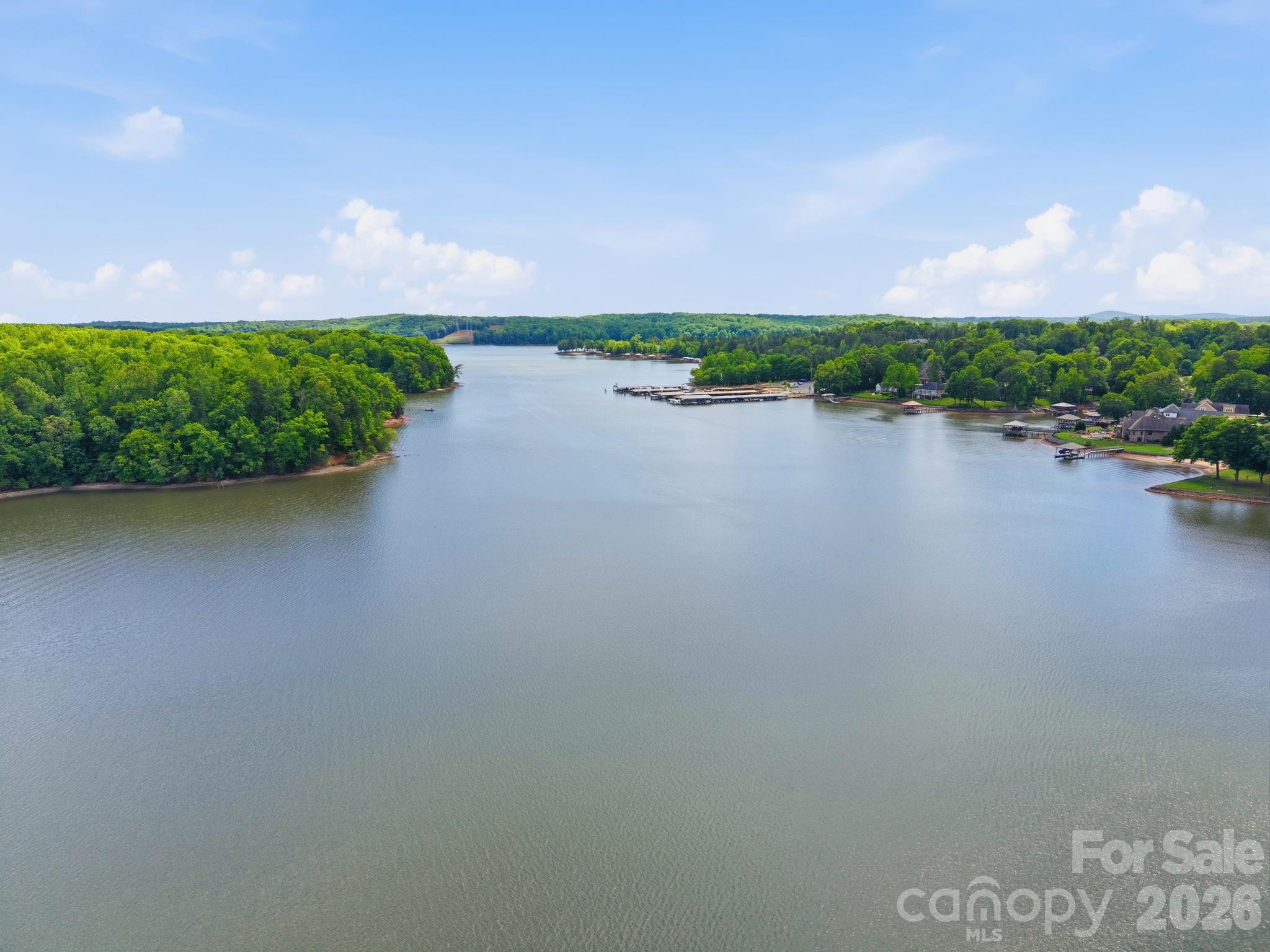 Discover the perfect canvas for your dream home on this stunning ¾-acre waterfront lot in the sought-after Misty Waters community. Nestled along the shores of Lake Wylie, this gently sloping property offers an ideal building site with sweeping water views and breathtaking sunset vistas.
Enjoy the tranquility of lakefront living with plenty of space for outdoor entertaining or simply relaxing while taking in the peaceful surroundings. 
Don’t miss the opportunity to own a slice of waterfront paradise—