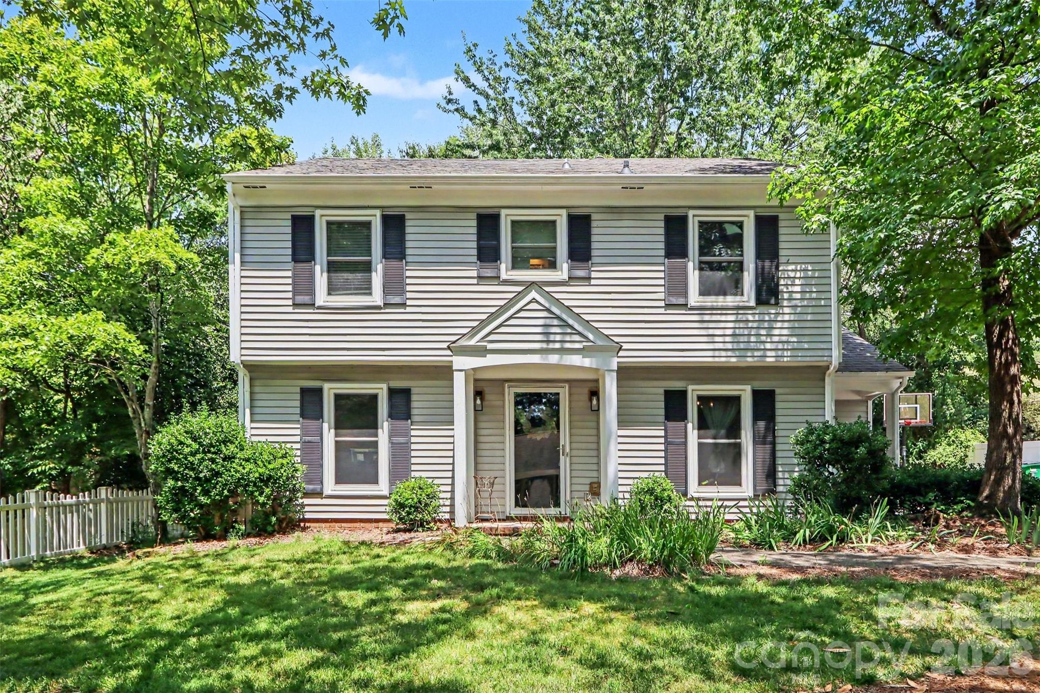 Welcome to Sardis Woods! Enjoy the convenience of being just minutes from I-74, shopping, restaurants, entertainment, everyday conveniences, McAlpine Creek Greenway, Matthews, SouthPark, and Uptown Charlotte. Nestled in a peaceful, well-maintained neighborhood with no HOA, this home offers great curb appeal, a concrete driveway, a large fenced and wooded backyard, storage shed, back patio, a new roof installed in 2025, and HVAC replaced in 2024. Inside, you'll find an abundance of natural light, neutral colors, and durable laminate wood flooring throughout much of the home. The main level features a spacious bonus room that could serve as a formal living room, a cozy den with a gas log fireplace, a formal dining room, and a mudroom with laundry. The kitchen is equipped with stainless steel appliances, Corian countertops, a large pantry, a breakfast nook, and direct access to the backyard. Upstairs, you'll find three generously sized secondary bedrooms with ample closet space, a hall bathroom, and a spacious primary suite featuring dual closets and an updated en-suite bathroom. With its desirable location, functional floor plan, major system updates, and no HOA, this home checks all the boxes. Schedule your showing today and see all it has to offer!