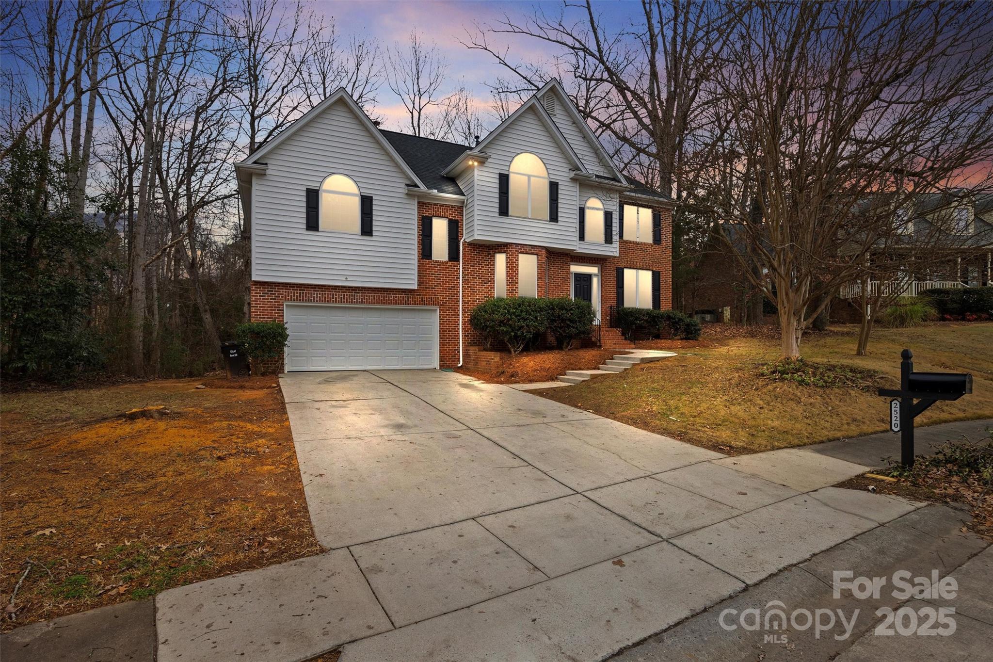 Welcome Home to 2520 Barrington Court, a stunningly updated residence that offers both classic curb appeal with today's most sought-after design finishes. This beautifully renovated 5 bed, 2.5 bath home offers 2751 square feet of thoughtfully reimagined living space. Step inside to discover an open, bright floor plan where every detail has been refreshed. The inviting main living areas showcase luxurious finishes, designer lighting, and premium flooring throughout. A chef-inspired kitchen greets you with sleek high-end cabinetry, quartz countertops, stainless steel appliances, gas cooking, and an oversized island perfect for meal prep and casual dining. The generous main level flows seamlessly, featuring a home office with custom built-ins and french doors for privacy, a large dining area with wainscoting details, and a beautiful gas fireplace. Upstairs, a spacious primary suite is tucked away from the other bedrooms, offering a serene retreat complete with a spa-style bath you won't want to leave, generous closet space with custom built-in systems, his and hers vanities, & more. Accompanied by 4 additional upstairs bedrooms and a beautiful and intelligently designed jack and jill bath. Every are of the home has been renovated with modern fixtures, beautiful tile work, and finishes that elevate every day living. Additional upgrades include fresh paint, new flooring, new hardware, contemporary accents, new roof, and quality craftsmanship throughout. All of the appliances were thoughtfully selected for the new owners and will remain. Outdoor living is equally impressive, offering water views of the neighborhood pond, a paver patio in the rear with retaining walls, plenty of cleared yard space, and mature trees tucking you away in privacy - perfect for summer gatherings or quiet evenings under the stars. Located in the desirable Royal Oaks neighborhood in Rock Hill, this home delivers convenience to shopping, dining, parks and major commuter routes while offering a peaceful community setting. Whether you're stepping into your forever home or making a smart investment in a high-demand market, 2520 Barrington court stand ready to impress - fully renovated, move-in ready, and designed to delight.