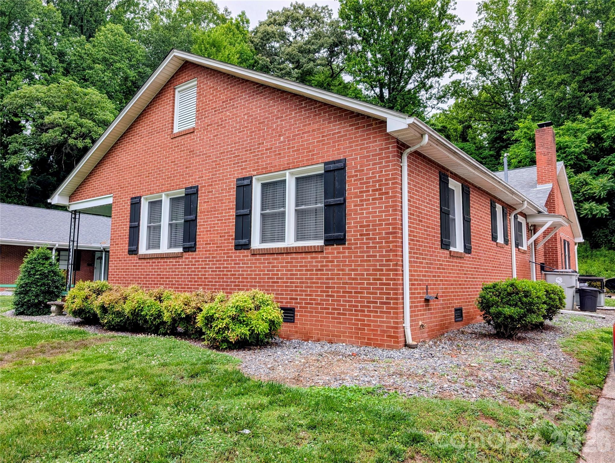 Welcome home! This charming 2-bedroom, 1-bathroom condo offers the perfect blend of comfort and convenience in the heart of Lenoir. Enjoy the ease of single-story living with zero worries about yard work or landscaping—it's all handled for you. Step out onto your patio to sip your morning coffee while listening to the songbirds, or take a leisurely stroll into downtown to explore the local shopping, dining, and entertainment. Complete with private carport parking and a large in-unit utility room off the kitchen, this beautifully maintained, move-in-ready home is ready for you to settle in.