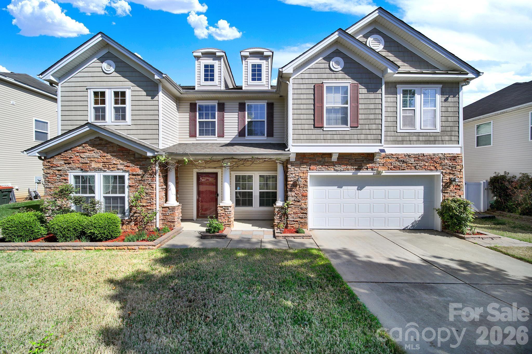 Gorgeous, updated home in sought-after Fort Mill, zoned for top-rated Fort Mill schools! This beautifully designed home offers an open and inviting main level featuring a formal sitting room, dining room, spacious great room, and a bright dining area—all flowing seamlessly for everyday living and effortless entertaining. The stunning, updated kitchen is the heart of the home, showcasing stylish cabinetry, stainless steel appliances including a French door refrigerator, and an oversized island perfect for gathering. A desirable main-floor guest suite with a fully renovated bath provides the ideal space for visitors or multi-generational living. Upstairs, retreat to the expansive primary suite with an elegant tray ceiling and a spa-like ensuite featuring a soaking tub, dual vanities, walk-in shower, and generous walk-in closet. Three additional bedrooms and a large bonus room offer plenty of flexibility for work, play, or relaxation. Step outside to enjoy the private backyard, complete with a covered patio just off the dining area and raised garden beds—perfect for growing your own summer favorites. Energy-efficient solar panels help reduce utility costs, adding even more value. Residents enjoy access to exceptional community amenities, including pickleball courts, a pool, tennis courts, playgrounds, and parks—making this home the perfect blend of comfort, convenience, and lifestyle.
