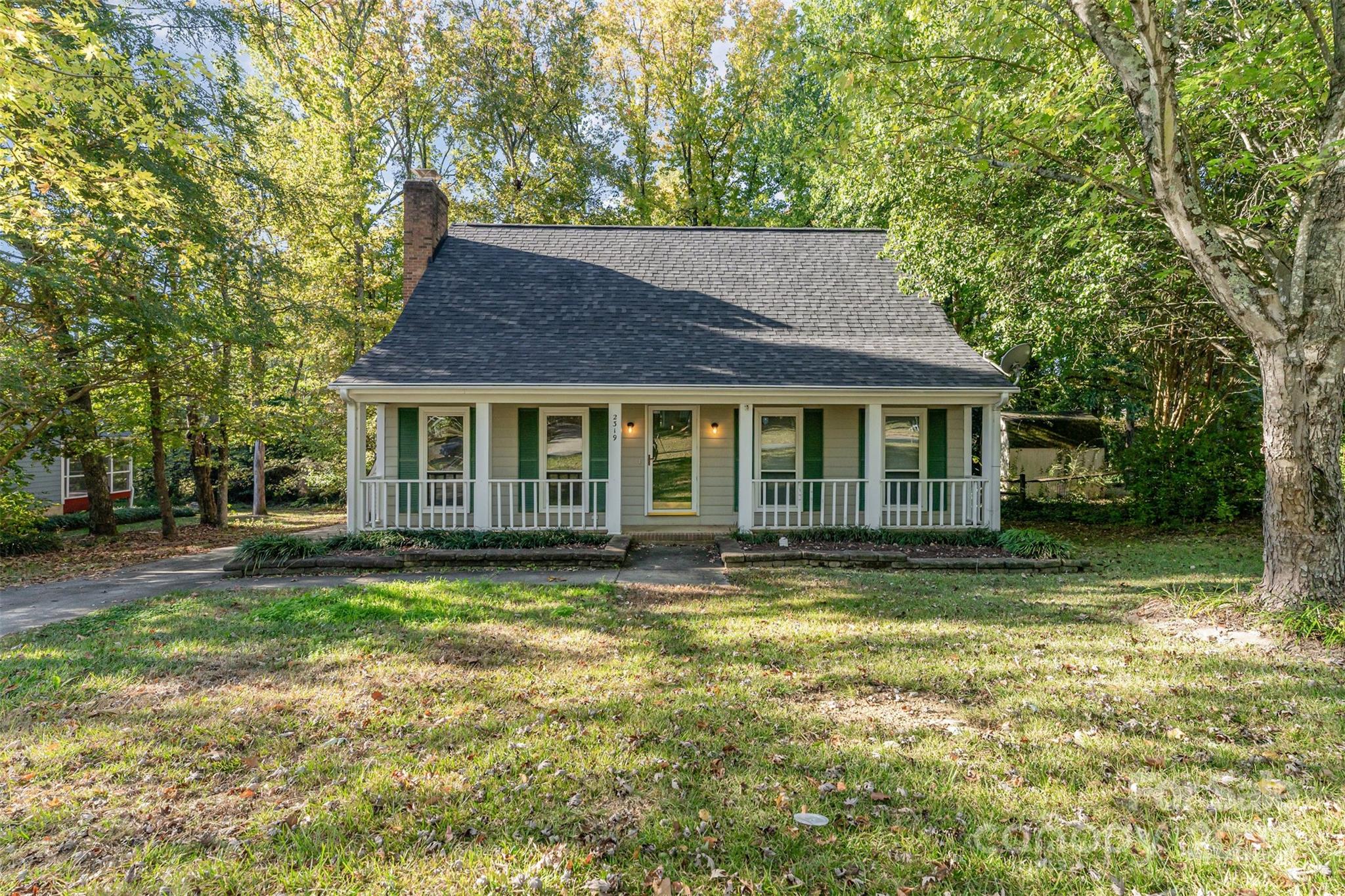 Discover the perfect blend of comfort and convenience in this 3-bedroom, 2-bath home. The living room features a cozy fireplace, and the fully equipped kitchen includes all appliances. The primary bedroom is located on the main floor, while an upstairs bedroom offers a skylight that fills the space with natural light. Outside, you’ll enjoy a large backyard on over half an acre, a front porch, back deck, and a spacious storage building for all your outdoor needs. Washer and dryer are included. This home is located just minutes from UNCC, I-485, shopping, dining, and the PNC Music Pavilion. No HOA. Property is currently tenant-occupied and leased at $1,799/month through December 2026.