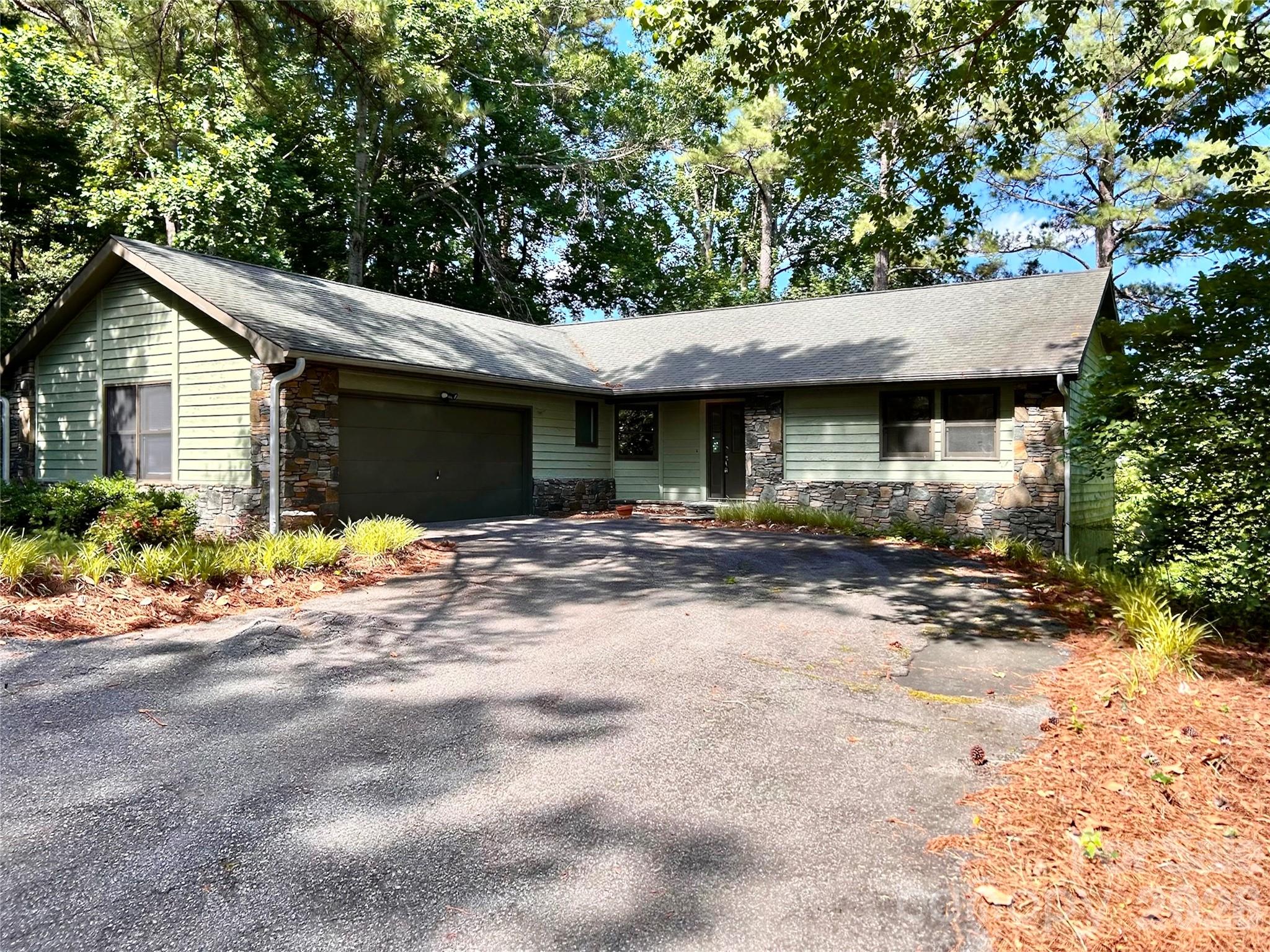 Tucked within the scenic Rumbling Bald community of Lake Lure, this peaceful retreat offers easy access and fully operational utilities Set on a .59-acre lot overlooking the 10th hole of the Apple Valley golf course, the home captures the essence of resort-style living. All three bedrooms and two full bathrooms are thoughtfully located on the main floor, offering the ease of one-level living. The spacious main-level kitchen opens seamlessly to a generous deck, perfect for outdoor dining or relaxing in the mountain air, while a second deck on the lower level adds space for entertaining or quiet enjoyment of the surroundings. Inside, updated tile and vinyl plank flooring, freshly painted interiors, and modern light fixtures bring warmth and character throughout. An attached garage adds daily convenience, and nearby community amenities—including an outdoor pool—round out the lifestyle. OWNER IS HAVING A RADON MITIGATION SYSTEM INSTALLED.
Owner is broker.