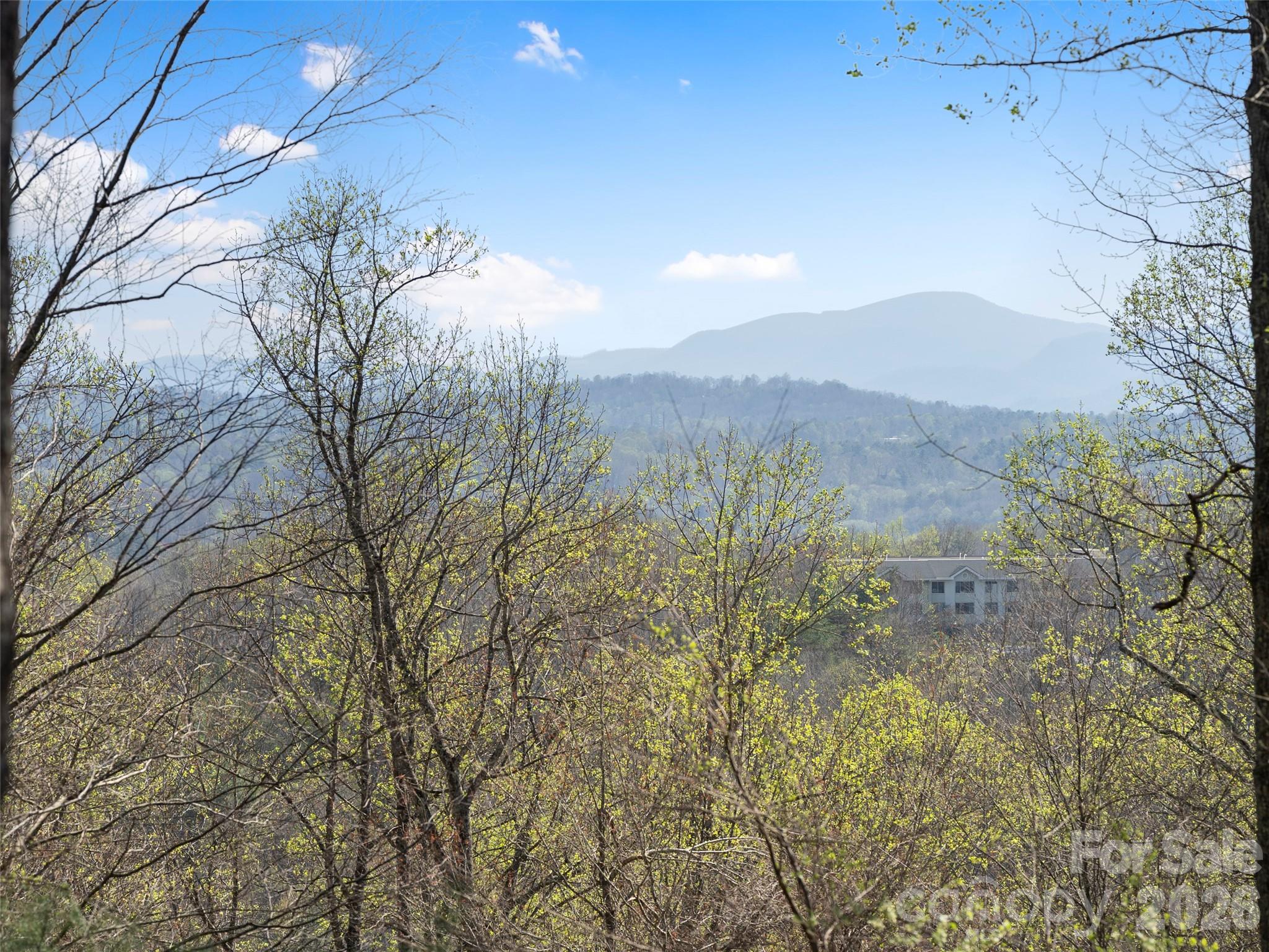 This premier 0.85-acre home site at 44 Ridge Pine Trail is positioned near the crest of a ridge within the exclusive, gated community of The Cliffs at Walnut Cove. The property features a perfectly gentle slope that offers exceptional building efficiency for either a one-level residence or a main-and-lower level home, all while capturing spectacular long-range mountain views. Located just minutes from the vibrant culture of downtown Asheville and the Asheville Regional Airport, this lot provides a rare sense of quietude where the only sounds are the whistle of the eastern towhee, the snap of a deer in the forest, and the call of a red-tail hawk overhead. Practicality meets luxury here, as a new four-bedroom septic permit was issued in December 2023, streamlining the path to creating your custom mountain retreat.

Living at Walnut Cove means more than just a beautiful home site; it offers a five-star lifestyle centered around wellness and world-class amenities. Residents can enjoy the Jack Nicklaus Signature Golf Course, which winds through a lush valley bordered by the Pisgah National Forest. The community is anchored by an 18,000-square-foot Wellness Center featuring indoor and outdoor saline pools, Har-Tru tennis courts, and a full-service spa. Social life revolves around the award-winning Tudor-style clubhouse and The Tavern. With private access to miles of hiking and biking trails and reciprocal privileges across all seven Cliffs communities, this location truly represents the pinnacle of mountain living in Western North Carolina.