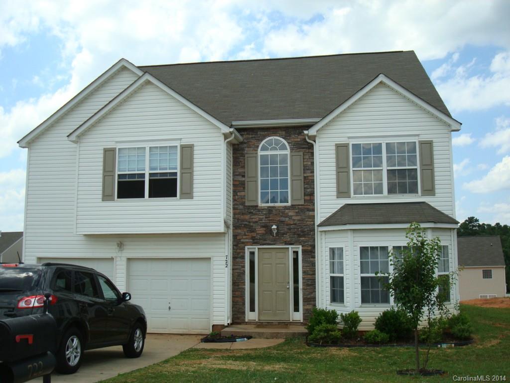 Formal and casual living areas with tons of light! Open LR/Din Rm, Great Rm w/wood burning FP & breakfast area. Hardwoods in foyer, breakfast area & kitchen.  Kitchen has island, pantry, corner sink w/window.  All bedrooms on upper level.  Nice sized master w/trey ceiling, master bath with separate shower/garden tub.  Convenient laundry closet on upper level.  Large yard.  Just a little TLC needed.