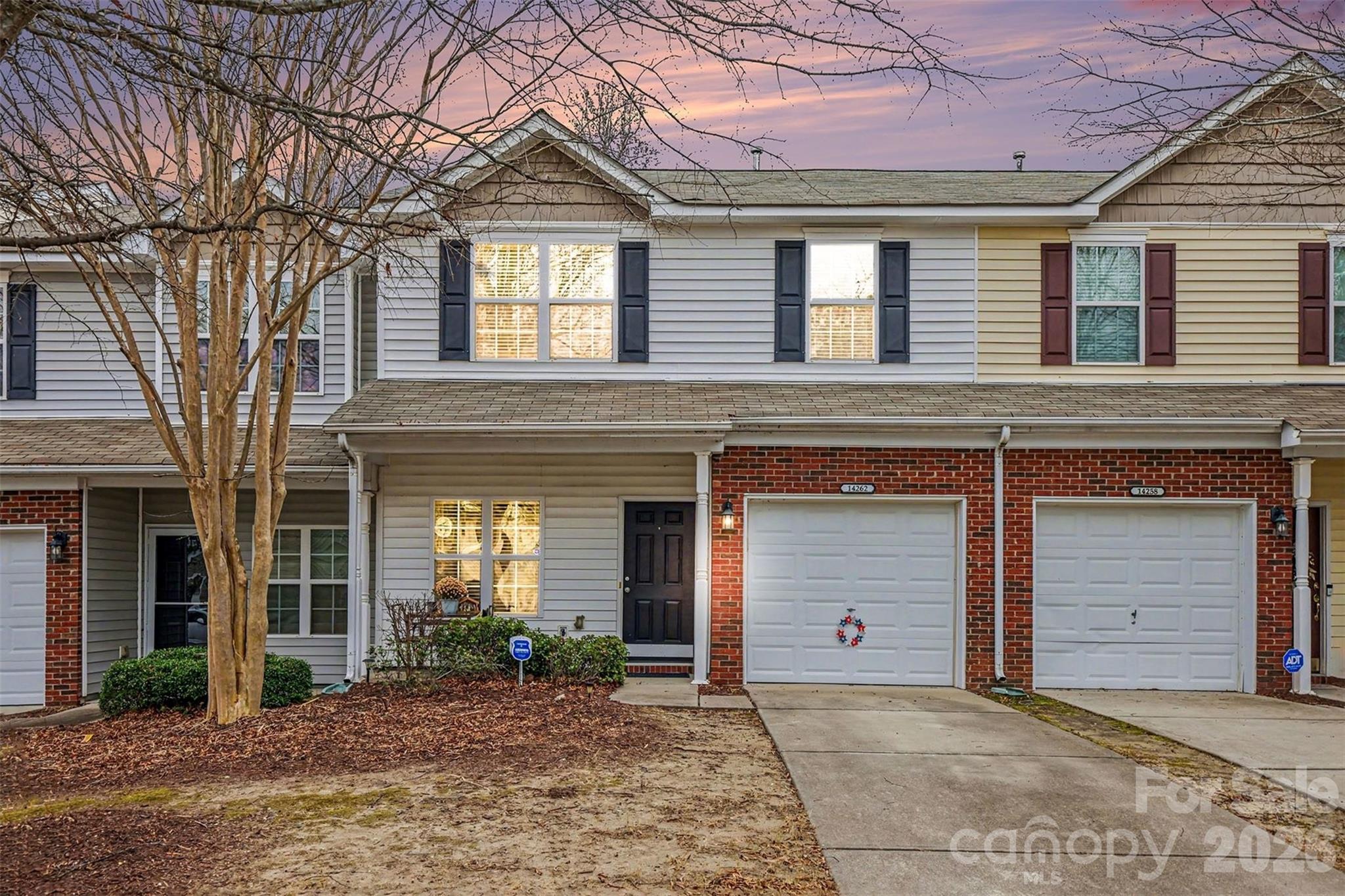 Welcome Home to Steele Creek! This well-kept, adorable Townhome is in sought-after Charlotte Pines! Ideal location: 5 min from beautiful Lake Wylie, Dining & Shopping in popular Rivergate, I-77, 485, CLT airport & Atrium Steele Creek Hospital, a short drive to Carowinds as well as the Charlotte Premium Outlets. Enjoy McDowell Nature Preserve & Nature Ctr which offers access to Public Boat Ramp, Kayak & Fishing hot spots. The first flr features the Kitchen, Dining & open floor plan LR w/ Fireplace & Sliding Glass Doors accented by a private walkout patio. Second Flr has two generously-sized BR full, each w/full BA, large closets, Laundry and beautifully-sized loft! You will enjoy the outdoor patio space overlooking natural greenery & woodland. Unit has a new TRANE (2021) unit for both central AC & heat for year-round comfort. Dedicated, locked, storage shed is available for personal use. 1 car garage is attached to the home.  Ownership includes Access to Private Community Pool, sidewalks, streetlights.  HOA responsible for exterior, roof, landscaping.