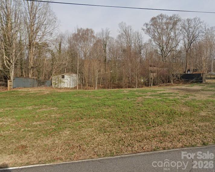 I want to invite you to the rare of the rare, This beautiful .51 acre FLAT lot in the Weatherstone Neighborhood located right off Hudlow Road minutes from Forest City, Spindale, Rutherfordton, and Lake Lure. NO HOA, light restrictions. The perfect combination of City and Country living at the end of quite Weatherstone Drive at the start of the Cul Da Sac, your going to peace and serenity here with little traffic, this property comes with a storage building, and a pool that you can either repair or fill in and use a private sitting area, and FLAT, which is hard to find in the WNC area. I invite you to come and check it out!