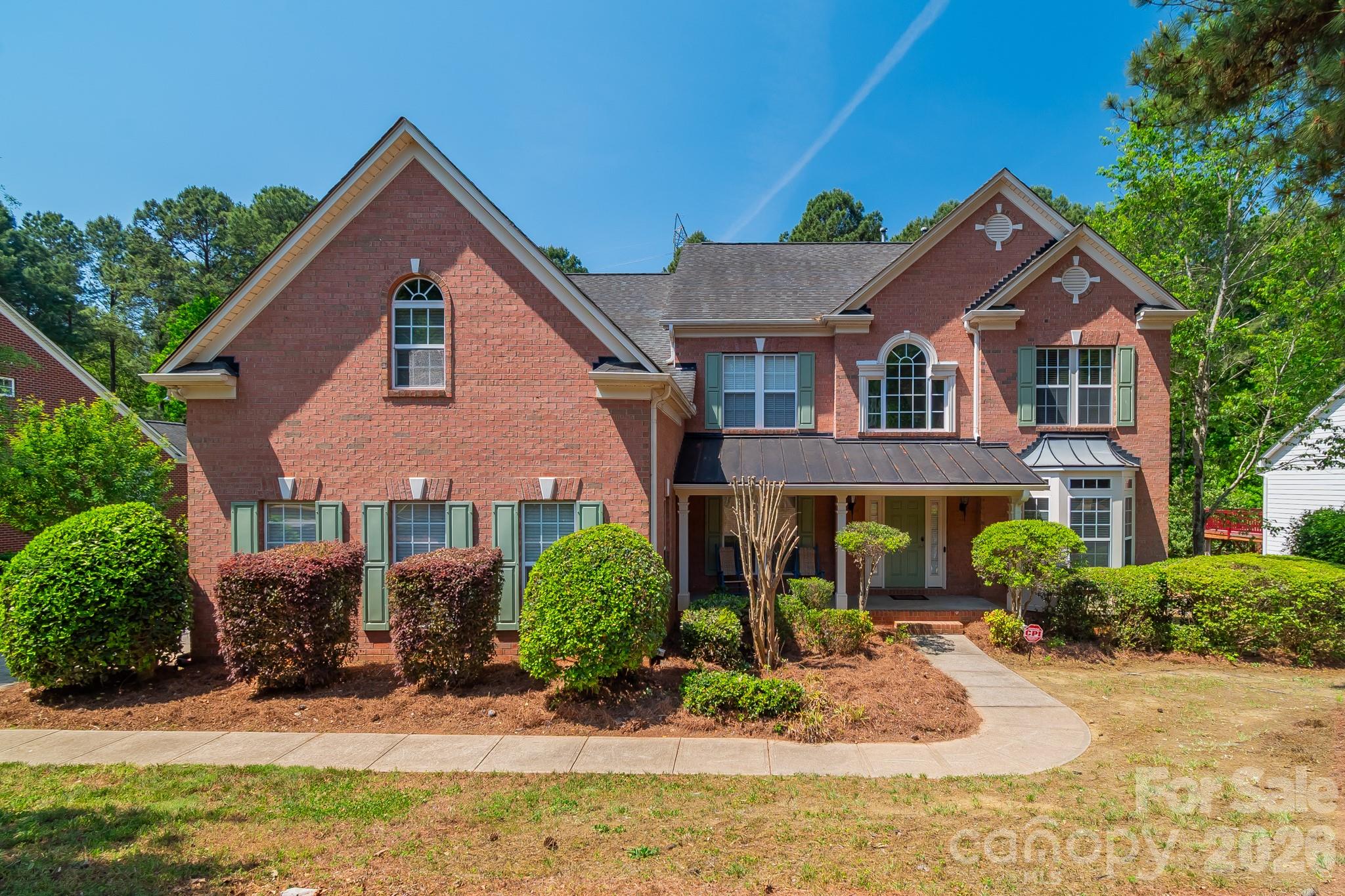 DONT MISS THIS ONE!!Discover luxury living in the prestigious Stonewater community on Mountain Island Lake!! This waterfront community is close to Uptown! HUGE Majority finished walkout basement on wooded private, fenced lot w/ access to walking trail and close to water access! Dramatic 2-sty foyer, 2 story great groom, Huge windows, Moldings. LR w/bay window, Office w/ French doors. The heart of the home is the spacious kitchen, complete with a huge island, granite countertops, stainless steel appliances, and a walk-in pantry, flowing seamlessly into the living area featuring a striking fireplace. Morning room/breakfast area with ample light and immediate access to huge deck. This 4 bedroom with 5th bed/bonus on main level offers thoughtfully updated living space.  Upstairs, the primary suite includes a spa-like bathroom and walk-in closets, with three additional bedrooms. From the basement, you can step outside to your private backyard retreat with fire pit, perfect for entertaining or unwinding. Stonewater offers an array of community amenities, including a pool, renovated clubhouse, pickleball, volleyball, tennis, and basketball courts, two playgrounds, and walking trails—truly a lifestyle beyond the home itself. Schedule your tour today!!