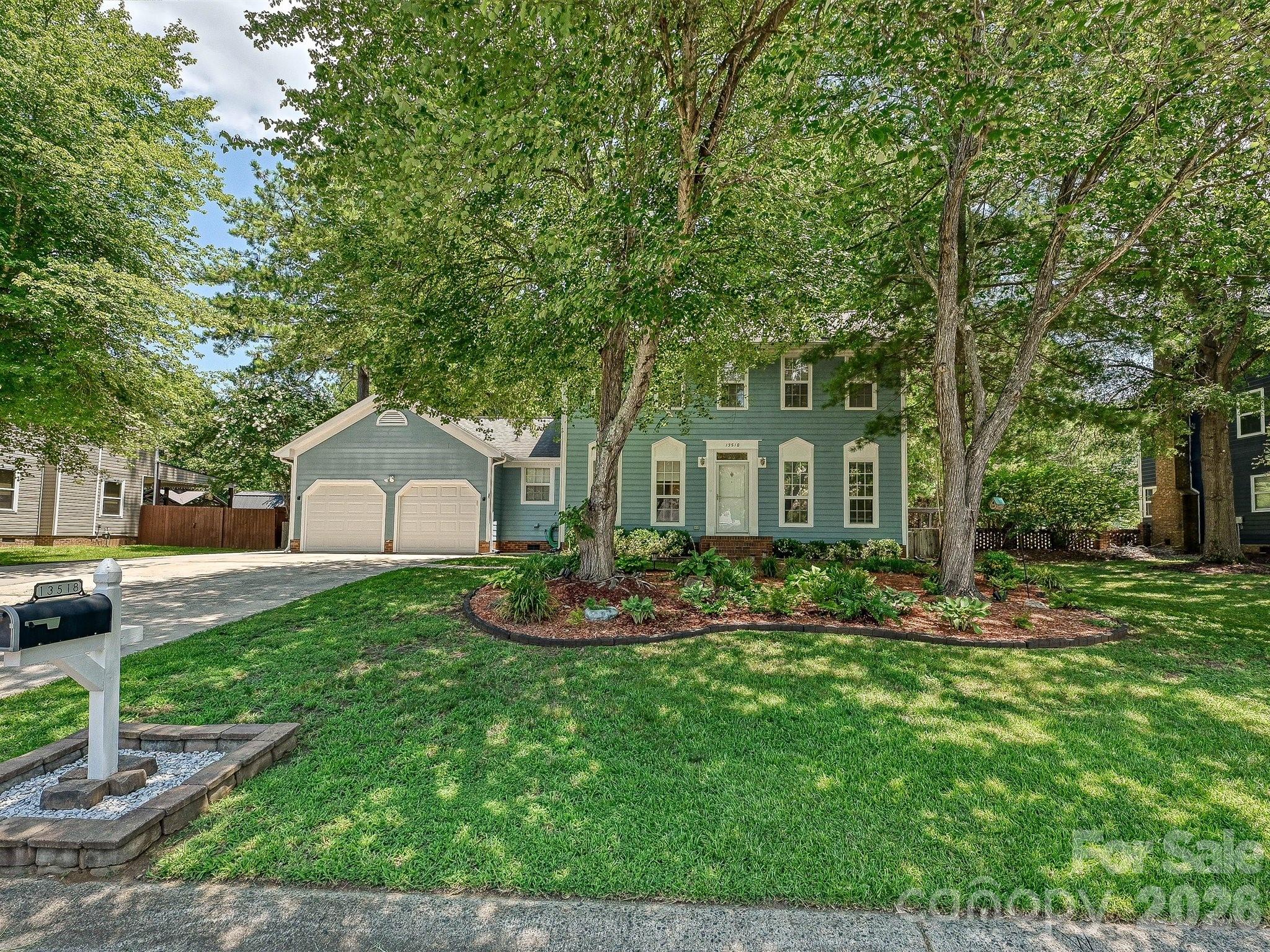 Imagine relaxing on your oversized, covered back deck overlooking a quiet, fenced backyard with nothing but the sounds of nature as there's no neighbor directly behind you. It's just the woods. This 4 bedroom Greycrest home with curb appeal for days blends classic architecture with the practical features you have been searching for. The main level offers an ideal layout for hosting: formal living and dining rooms flow seamlessly into an eat-in kitchen with a gas stove and granite countertops, leading directly into a cozy den. Practical updates are everywhere, from low-maintenance laminate flooring and customized bedroom closets to newly updated bathroom cabinetry. Forget about parking headaches. The property features a 2 car garage with built-in shelving/cabinets, mats on the flooring and a rare, expansive concrete driveway with room for 8 more cars. Gather around the den fireplace, which is electric but ready to convert back to gas, or easily hook up your laundry with dual gas and electric dryer lines. Located in a community with a wildlife pond, volleyball court, picnic areas and playground, all within a short drive to the Rivergate Shopping Center, restaurants, and more!