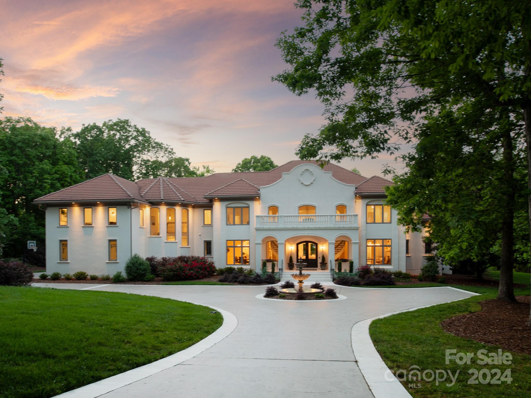 Experience 9712 Sedgefield Drive, a one of a kind home in the exclusive gated Sedgefield, a serene enclave of homes on estate sized lots in Marvin Schools. This home has been updated with no cost spared and overlooks one of three neighborhood ponds. Sitting on almost 3 acres, you are surrounded by nature and privacy. This home was designed with comfortable living in mind and grand entertaining.  Kitchen was completely renovated in 2023 and all bathrooms have been refreshed.  The layout is perfect with primary and office on the main and 4 bedrooms (all with ensuites) and 2 bonus rooms upstairs. Enjoy the outdoors from all of the great terraces and pool/spa. A masterpiece of craftsmanship and luxury, this home has unmatched seclusion and lush natural setting to enjoy the North Carolina weather!