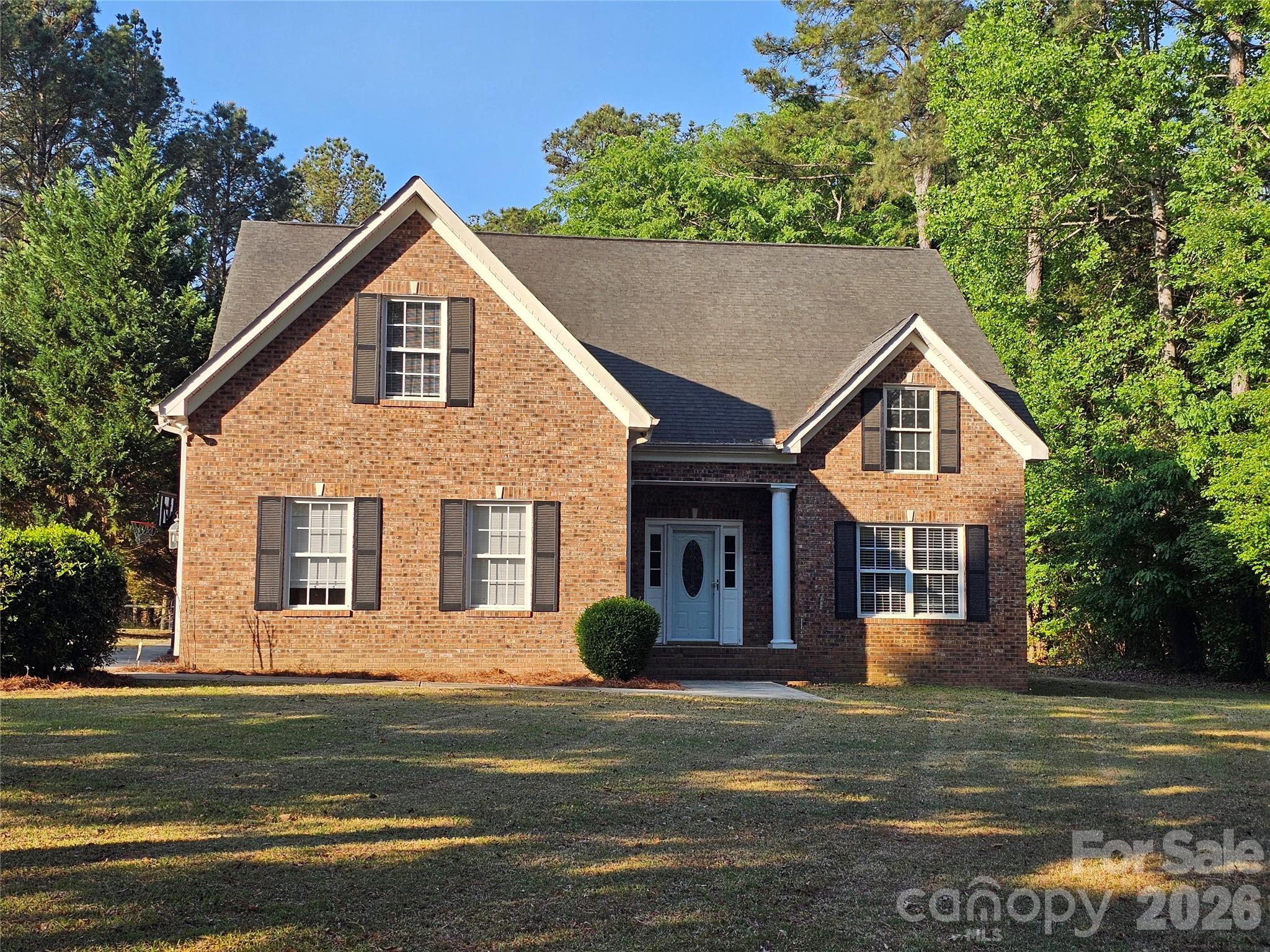 COMMUTER'S DREAM!  Located only 1 mile from I-77 (Exit 65) in the Richburg area, this Cherry Hills home offers easy access in a quiet location.  Cherry Hills is well-known as a quality neighborhood and this 2-story brick home is no exception.  With over 2600 HSF and a dual-lifestyle layout, you'll have plenty of space for everyone.  Total living area encompasses 4 bedrooms, 2.5 bathrooms and much more.  MAIN LEVEL includes formal dining room with cathedral ceilings and chandelier: large kitchen with oak cabinets, walk-in pantry, room for a pub table and access to the enclosed back porch; comfortable-sized living room; primary bedroom with tray ceilings, en suite and walk-in closet; guest bathroom; laundry room with oak cabinets and access to the 2-car garage; and stairs to the upper level.  UPSTAIRS offers a spacious loft common area as the focal point; 3 bedrooms, 1 full bathroom, and a executive-sized bonus room.   OUTSIDE includes a level front yard with shade, private backyard, concrete sidewalk and driveway, brick light pillars and a brick mailbox.  Plenty of space, privacy and convenience... and Lewisville Schools.